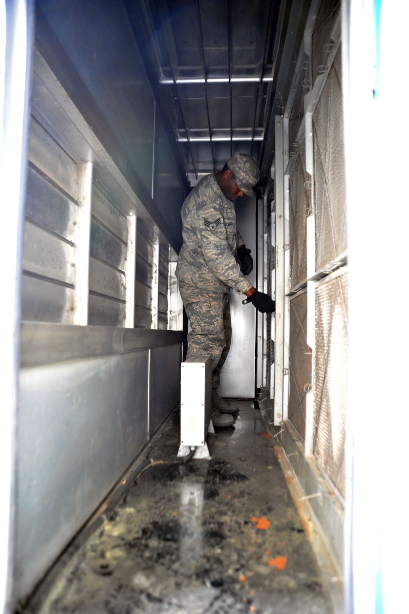 KUNSAN AIR BASE, Republic of Korea -- Senior Airman Edgar Denard, 8th Civil Engineer Squadron heating, ventilating, air conditioning and refrigerating technician, changes filters on a system here Aug. 4. HVAC Airmen maintain 1.7K HVAC/R Systems base wide and assist Army with specialized air conditioning equipment.  (U.S. Air Force photo/Senior Airman Brittany Y. Bateman)
