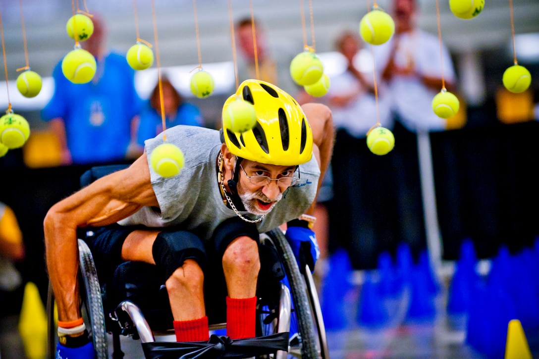 Navy veteran Terry Rock competes in the slalom obstacle course as part of the 31st National Veterans Wheelchair Games at the David L. Lawrence Convention Center in Pittsburgh, Aug. 3, 2011.