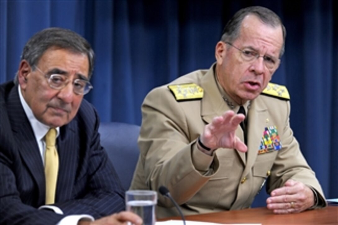 Chairman of the Joint Chiefs of Staff Adm. Mike Mullen responds to a reporter's question during a Pentagon press briefing with Secretary of Defense Leon E. Panetta on Aug. 4, 2011.  It was Panetta's first press briefing since becoming secretary.  