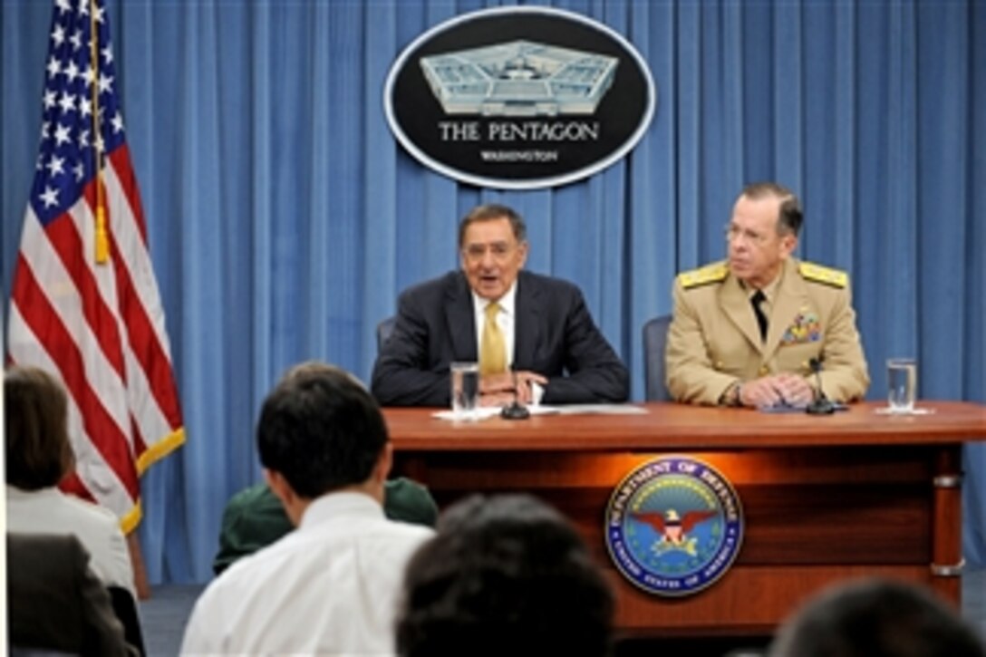 Secretary of Defense Leon E. Panetta responds to a reporter's question during his first Pentagon press briefing on Aug. 4, 2011.  Joining Panetta is Chairman of the Joint Chiefs of Staff Adm. Mike Mullen.  