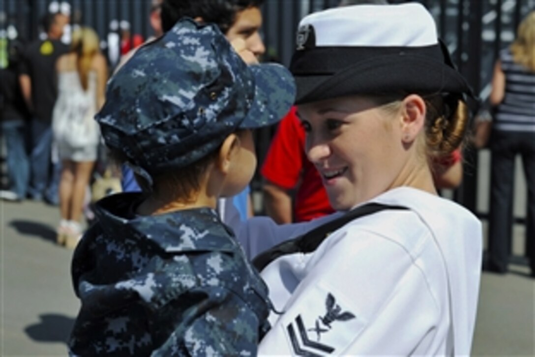 U.S. Navy Yeoman 2nd Class Victoria Kent reunites with her son after a five-month deployment aboard the amphibious dock landing ship USS Cleveland in San Diego, Aug. 4, 2011. The Cleveland took part in Pacific Partnership 2011, which provided humanitarian aid to several isolated Pacific nations.