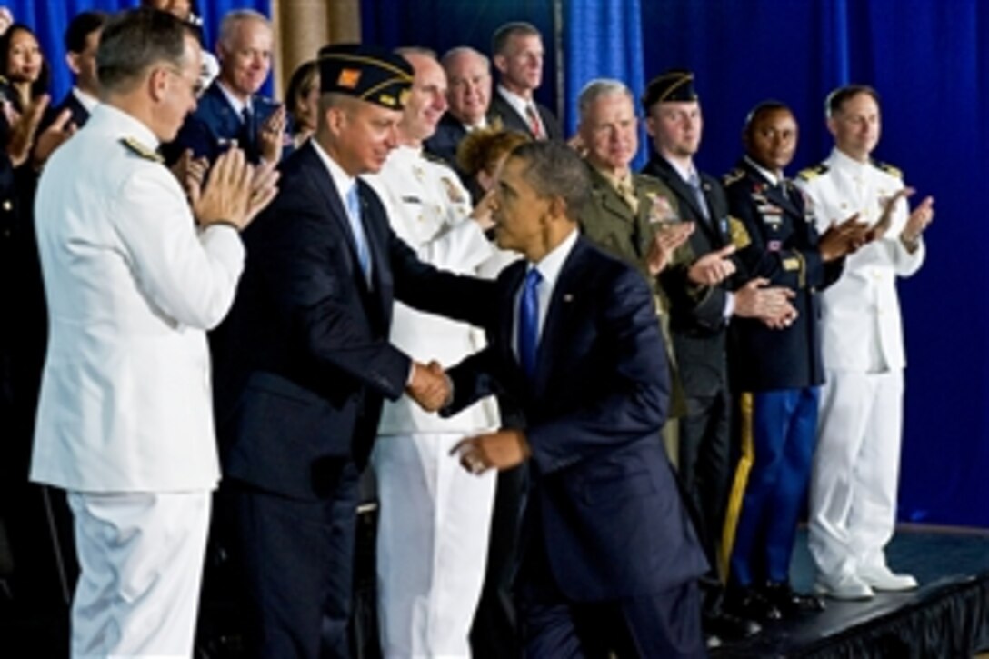 President Barack Obama greets guests, including military veterans, after speaking at the Washington Navy Yard in Washington, D.C., Aug. 5, 2011. Obama discussed a series of administration initiatives to help America's veterans find employment.