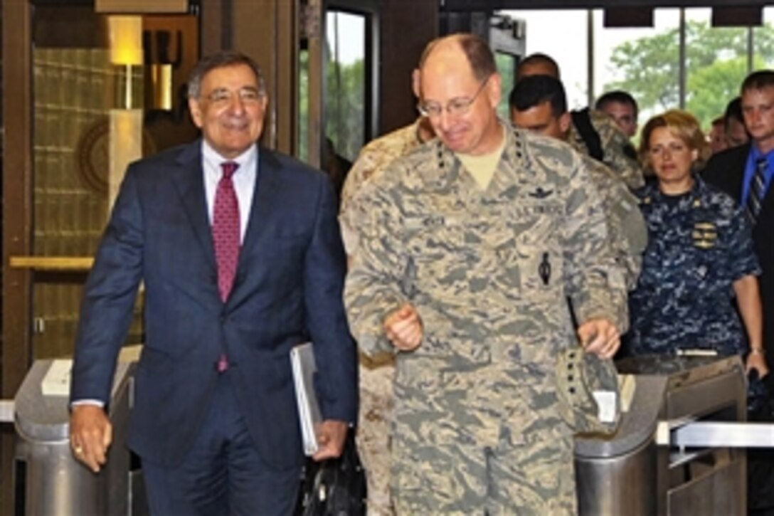 Defense Secretary Leon E. Panetta walks with Air Force Gen. C. Robert Kehler, commander of U.S. Strategic Command, during an Aug. 5, 2011, visit to the command's headquarters at Offutt Air Force Base, Neb.