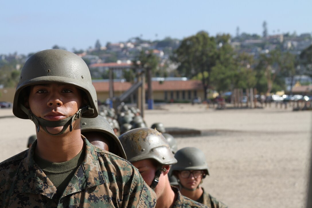 Recruits from Company C line up at the bottom of a ladder to wait to go down the rappel tower aboard Marine Corps Recruit Depot San Diego Aug. 5. Some recruits shook in anticipation and fear as they waited.
