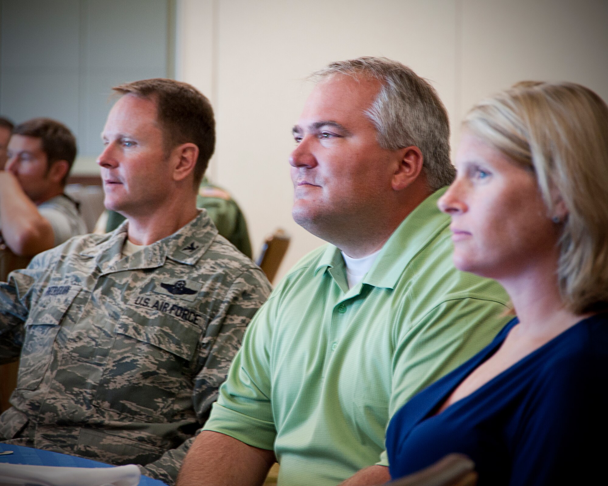 Colonel Louis Patriquin, 403rd Operations Group commander, sits next to his new Honorary Commander, Aaron Hayek and his wife Maggie, at the 403rd Wing's Honorary Commander induction ceremony Aug. 6. Hayek is the founder and president of Chempro Services and was among the 14 new Gulf Coast civic leaders inducted into the Wing's Honorary Commander program. (U.S. Air Force Photo by Staff Sgt. Brent Skeen)