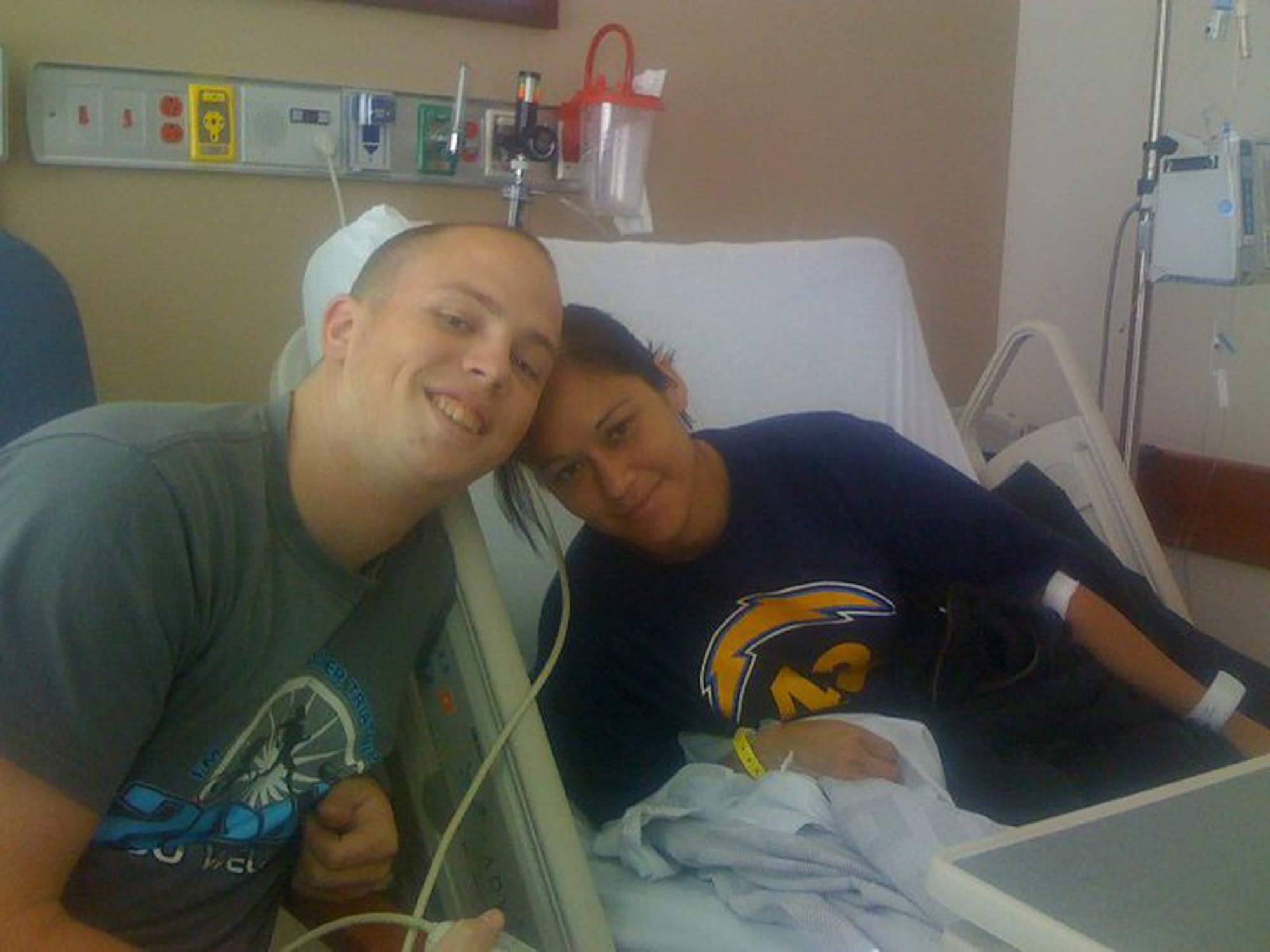 WAITING TO INHALE - After nearly drowning, 2nd Lt. Naomi Hume shares a lighter moment with her rescuer and dive partner, 2nd Lt. Aaron Hoff, at a critical care unit in Tallahassee, Fla. (Photo by Courtesy of 2nd Lt. Aaron Hoff)