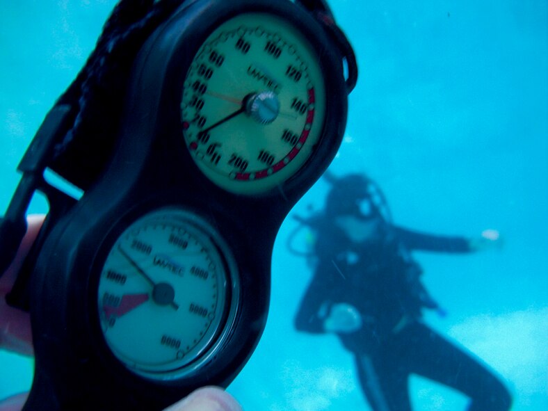 WAITING TO INHALE - Using their depth gauge, the diving duo realized they had gone 65 feet in the wrong direction to a depth of 80 feet in the murky waters of St. Andrew’s Bay, Fla. (Photo by TSgt Samuel Bendet)