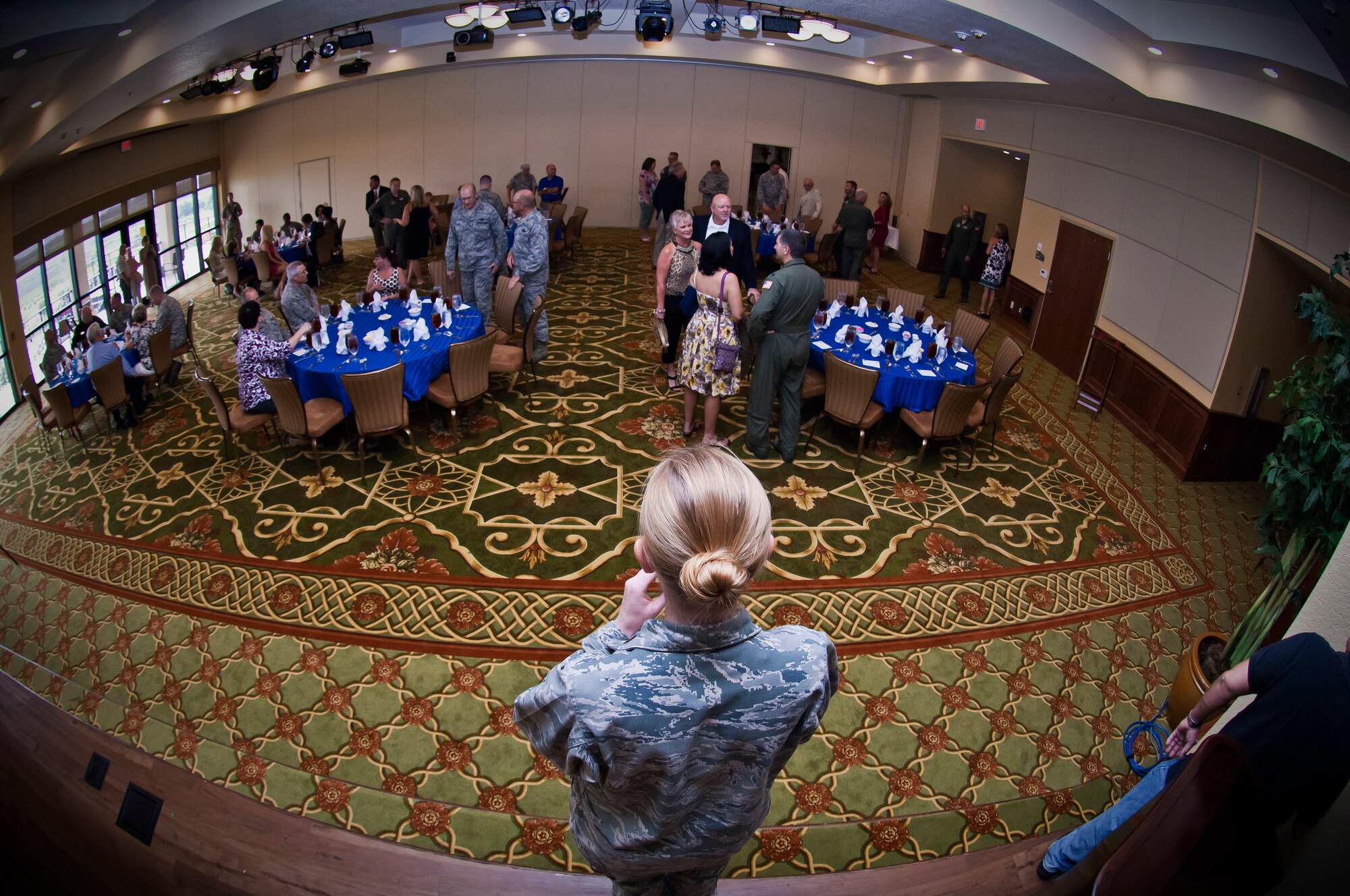 Major Heather Newcomb, 403rd Wing chief of Public Affairs, welcomes the Reservists and Gulf Coast civic leaders to the Wing's Honorary Commander induction ceremony Aug. 6. Fourteen civic leaders were inducted into the Wing's Honorary Commander program during the ceremony and luncheon held in their honor. (U.S. Air Force Photo by Capt. J. Justin Pearce) 