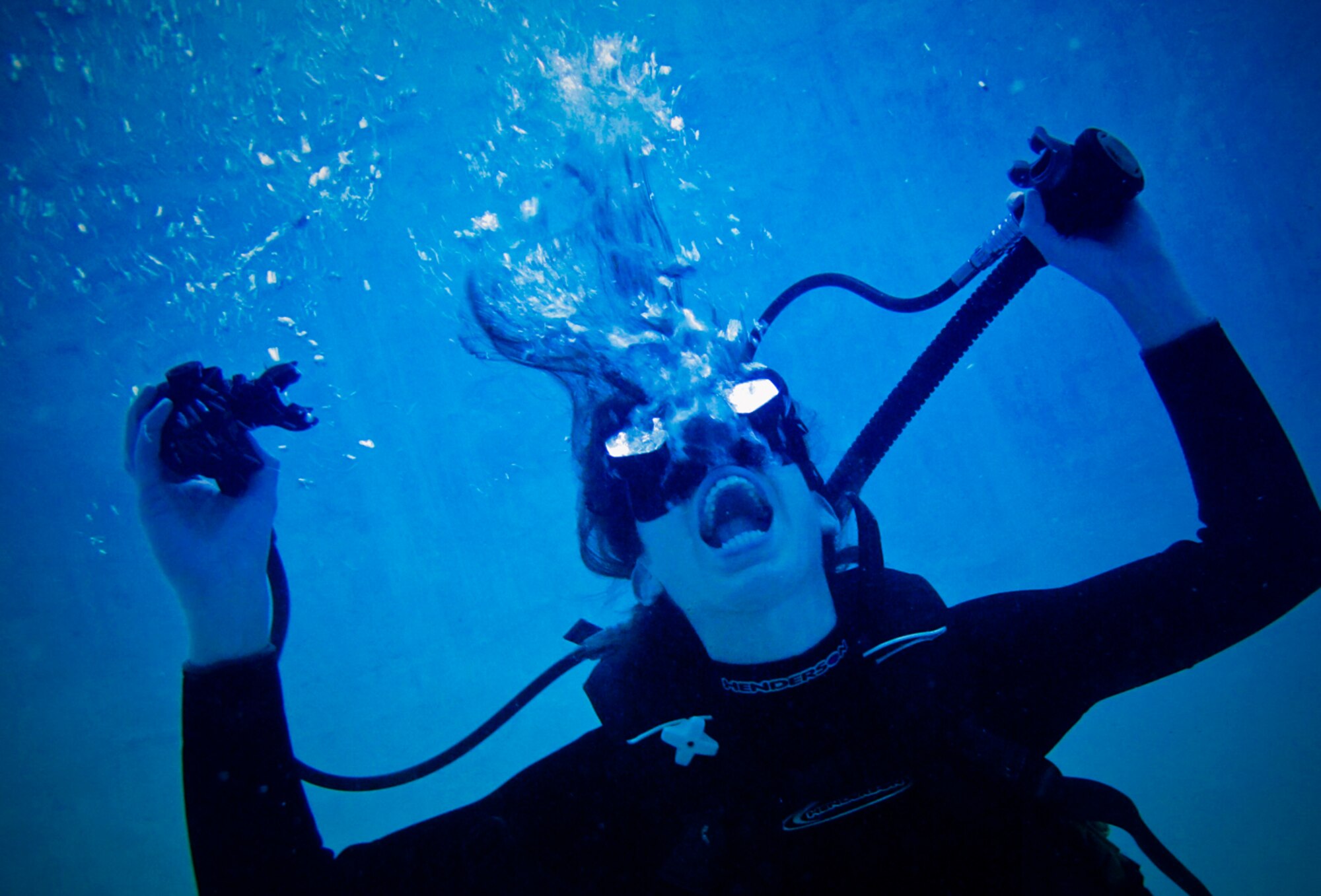 WAITING TO INHALE - A second lieutenant ripped her respirator mouthpiece, making it inoperable, when she panicked during a dive. She blacked out 30 feet from the surface. (Photo by TSgt Samuel Bendet)
