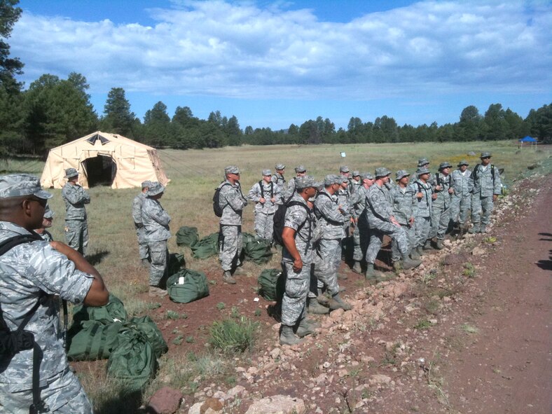 Dozens of 162nd Mission Support Group Airmen form up for an in-brief from Golden Falcon exercise organizers before putting their training to use at Camp Navajo in Belmont, Ariz., July 17. (U.S. Air Force photo/Lt. Col. Garry Beauregard)