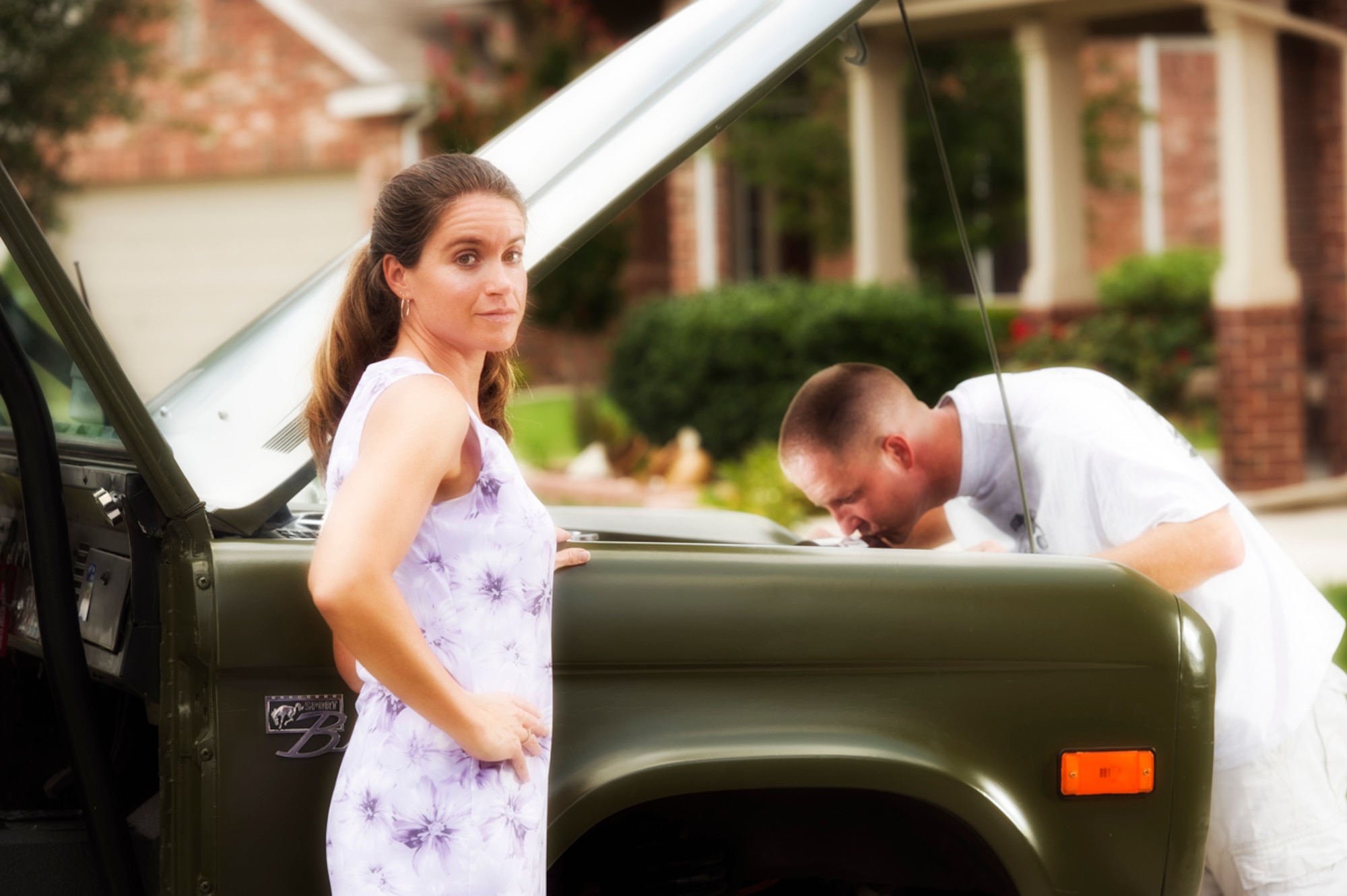 TEMPTED BY THE OTHER WOMAN - Stacey Meyer has to share her husband, 
Chief Master Sgt. Charles Meyer, with his second love: a 1972  Ford Bronco. (Photo by TSgt Samuel Bendet)