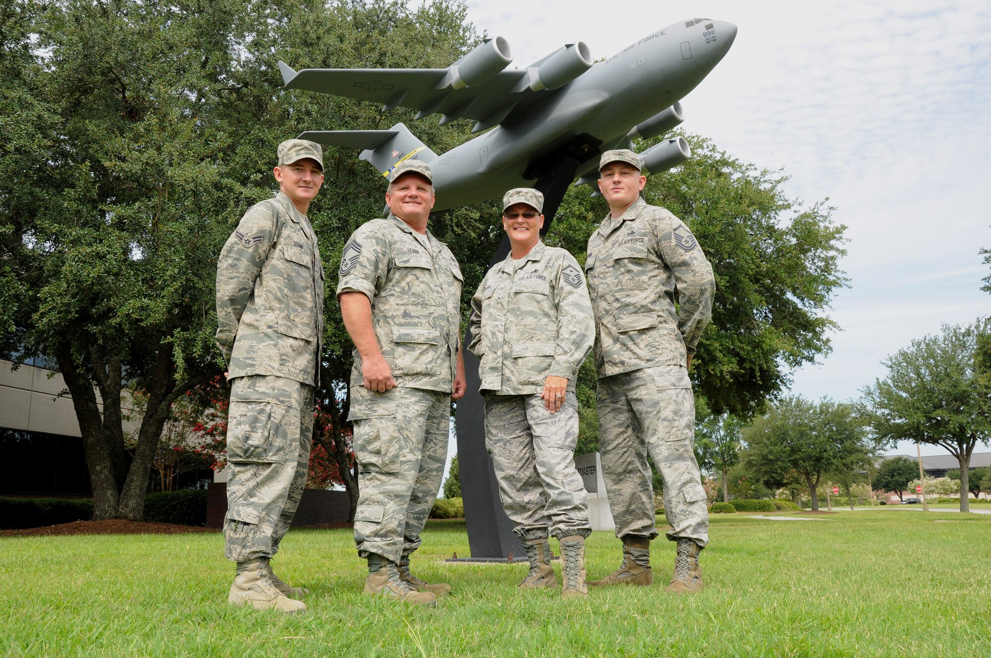 The Learn family, all reservists with the 315th Airlift Wing, stand outside Joint Base Charleston, S.C. headquarters building July 24, 2011.  (Left to Right) Airman 1st Class Gordan P. Learn, hydrolic systems specialist 315 Aircraft Maintenance Squadron, Chief Master Sgt. Ricky E. Learn, 315 AMXS "Blue" aircraft maintenance unit flight chief, Master Sgt. Cynthia E. Learn, First Sergeant 315th Security Forces Squadron and Master Sgt. Richard K. Learn, an inegrated avionics craftsman assigned to the 315 AMXS. (U.S. Air Force Photo by Senior Airman Bobby Pilch)