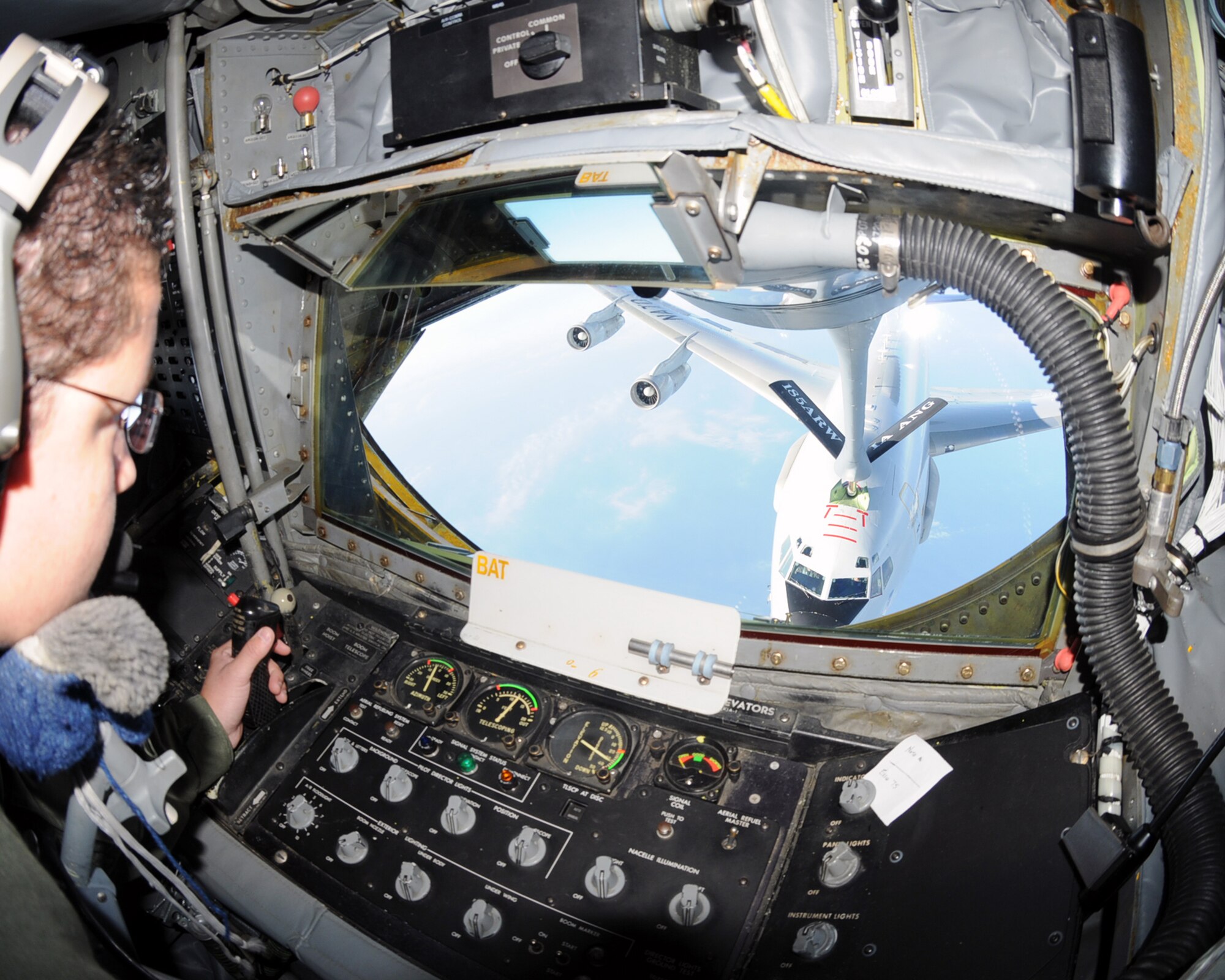 Technical Sgt. Misty McNamara, 185 Air Refueling Wing,Sioux City, Iowa, guides the boom durring an air-to-air refueling of an E-3a AWACS over the North Sea on a training mission on the 28th of July.