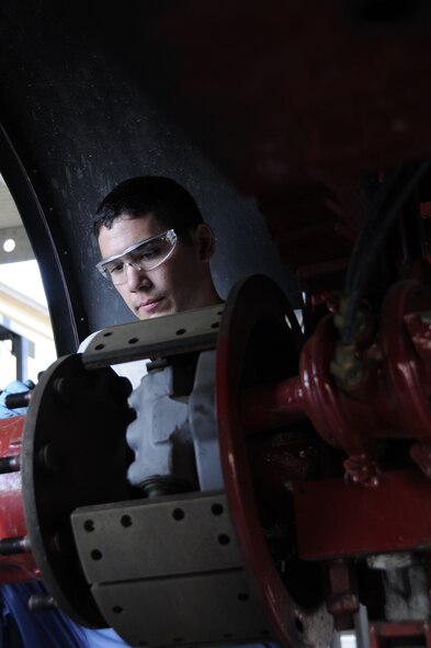 U.S. Air Force Senior Airmen Ryan Calzada, a vehicle mechanic with the 144th Logistics Readiness Squadron, replaces a brake drum on a fire truck in Fresno, Calif. on Aug. 6, 2011. As a vehicle maintenance personnel he is in charge of keeping vehicles running so the 144th Fighter Wing can complete its mission and respond to emergencies. (U.S. Air Force photo by Tech. Sgt Robin D. Meredith)