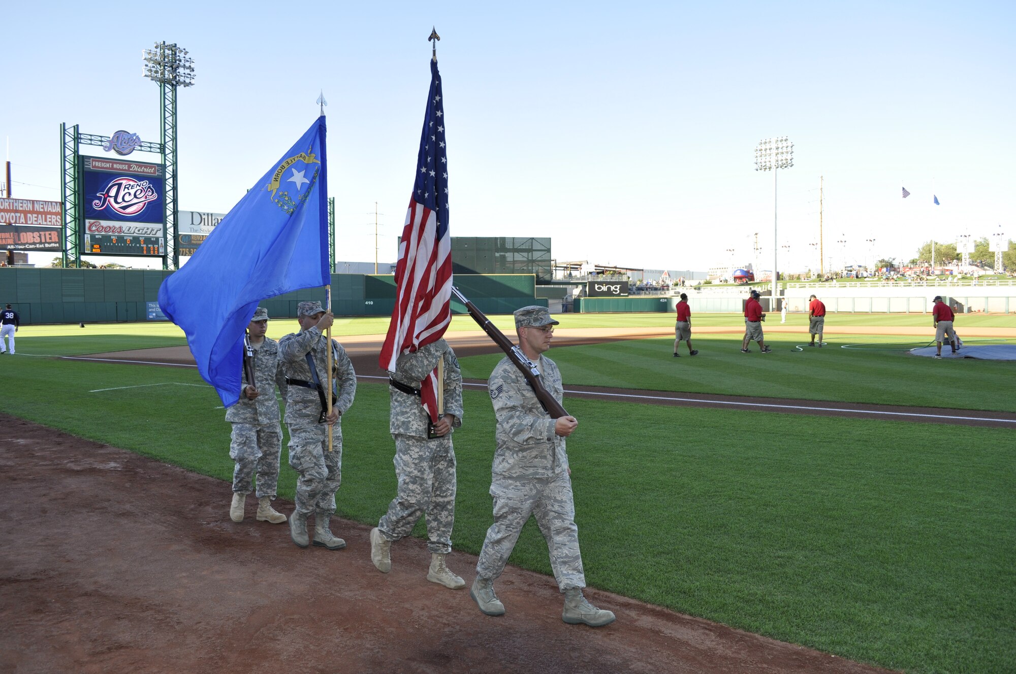 Members of the NV Honor Guard marching onto the field at the Reno Aces Military Appreciation night.