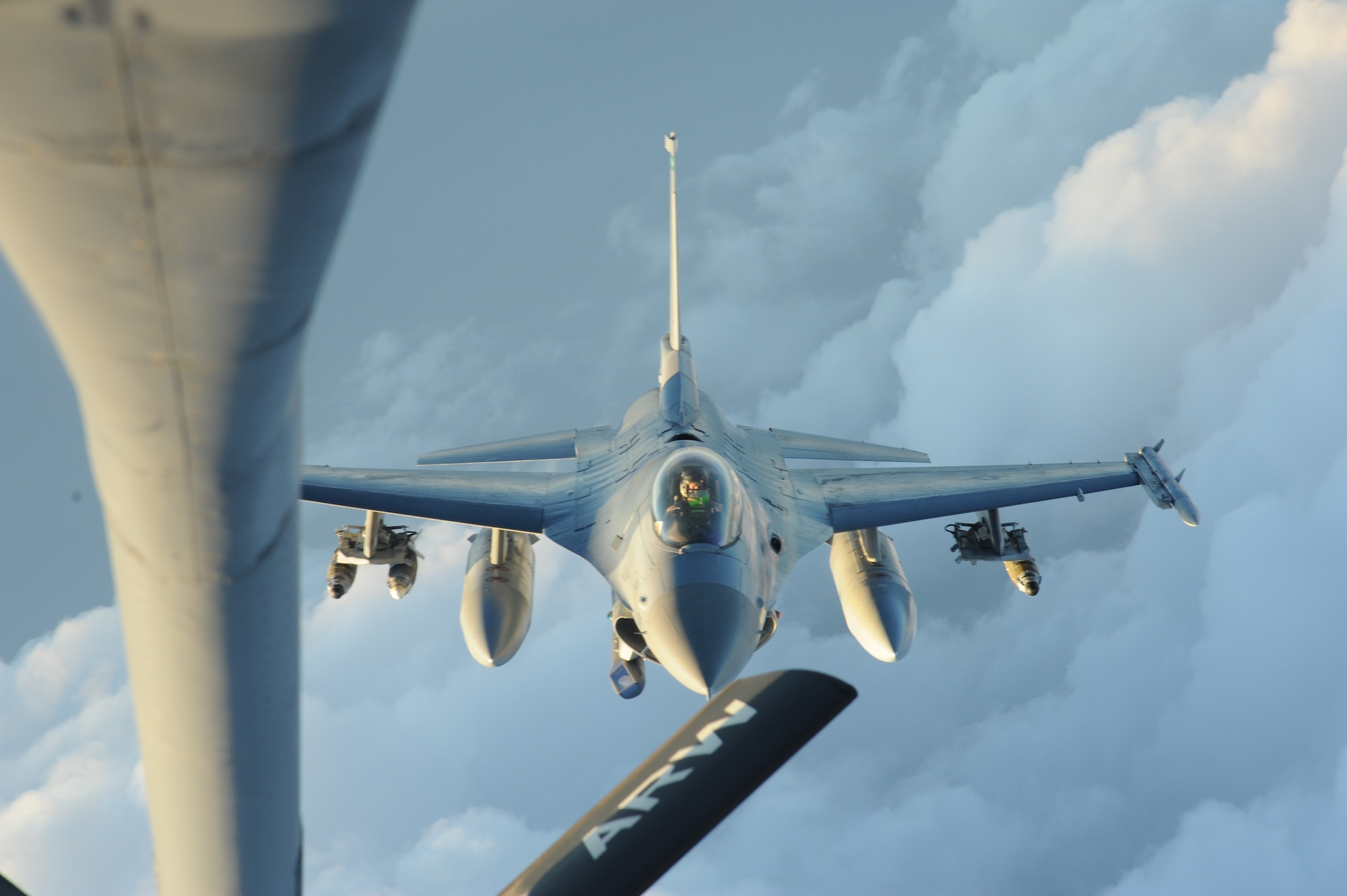A KC-135 Stratotanker deployed to the 22nd Expeditionary Air Refueling Squadron at the Transit Center at Manas, Kyrgyzstan, refuels an F-16 Fighting Falcon deployed from Aviano Air Base, Italy, July 30. The 22nd EARS aircrews flew 493 sorties in July breaking the Transit Center’s prior record which was only a month old.  (U.S. Air Force photo/Tech. Sgt. Hank Hoegen)