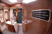 KUNSAN AIR BASE, Republic of Korea -- Tech. Sgt. Matthew Teets, the NCO in charge of Kunsan’s chapel, sets up the Blessed Sacrament room inside the base chapel here Aug. 4. As the NCOIC, Teets is responsible for all enlisted matters and ensuring his two fellow chaplain assistants meet the needs of the three assigned chaplains -- two Protestant, one Catholic.  (U.S. Air Force photo/Master Sgt. Sonny Cohrs)