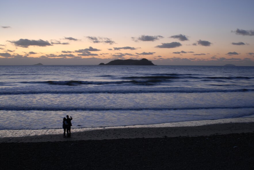 A couple takes photographs on a beach near Sinya-ri, Republic of Korea. (U.S. Air Force photo/Staff Sgt. Eric Burks)