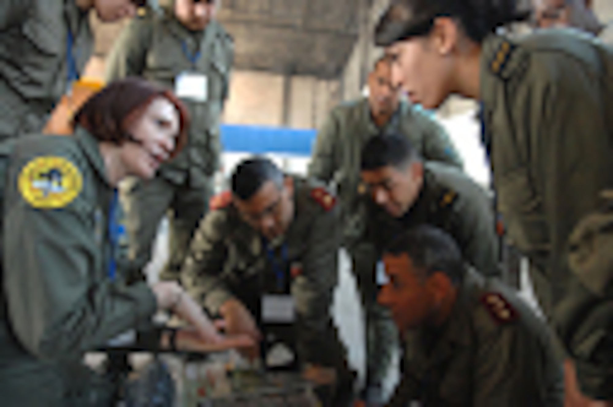 U.S. Air Force Tech. Sgt. Danielle Romero (left), Critical Care Air Transport Team (CCATT) Respiratory Therapist from the 934th Aeromedical Staging Squadron, Minneapolis ARS, Minn., explains to Tunisian Army Medical Health Service personnel how a ventilator assists in patient breathing as part of a medical demonstration at Kharrouba Air Base, Tunisia Nov. 15, 2008 during Medlite 2008. Medlite is a Joint Chiefs of Staff Exercise designed to provide and exchange medical skills, techniques and procedures between members of the U.S. Air Force, U.S. Army and Tunisian Military Health Services. (U.S. Air Force photo by Senior Airman Erica Knight)