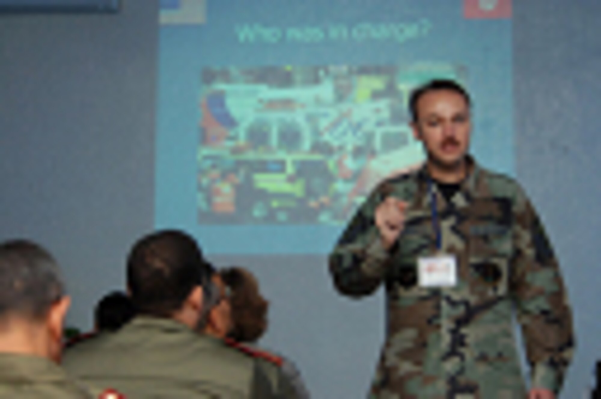 U.S. Air Force Master Sgt. Timothy Allen, Non-Commissioned Officer in Charge of Air Force Operations, from the 435th Medical Squadron, Landstuhl Regional Medical Center, Germany, holds a presentation for U.S. and Tunisian medical military personnel on the role of medical teams after a terrorist attack at Kharrouba Air Base, Tunisia, during Medlite 2008. Medlite is a Joint Chiefs of Staff Exercise designed to provide and exchange medical skills, techniques and procedures between members of the U.S. Air Force, U.S. Army and Tunisian Military Health Services. (U.S. Air Force photo by Senior Airman Erica Knight)