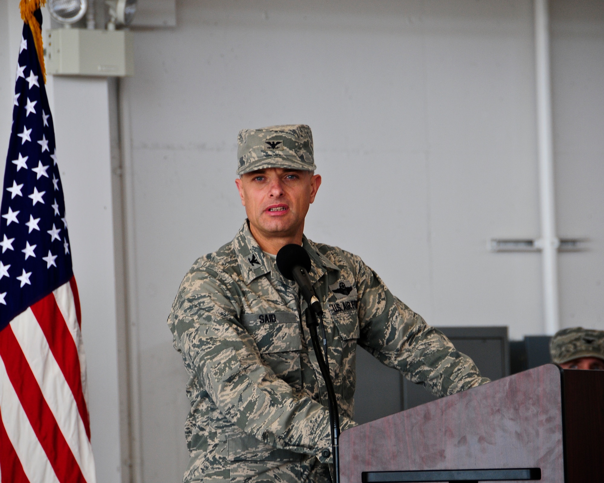 Col. Sami Said, 144th Fighter Wing Commander, adresses the Airmen of the 144th Maintenance Group during a change of command ceremony August 7, 2011. Col. Mark Favetti assumed command of the 144th Maintenance group during the ceremony.