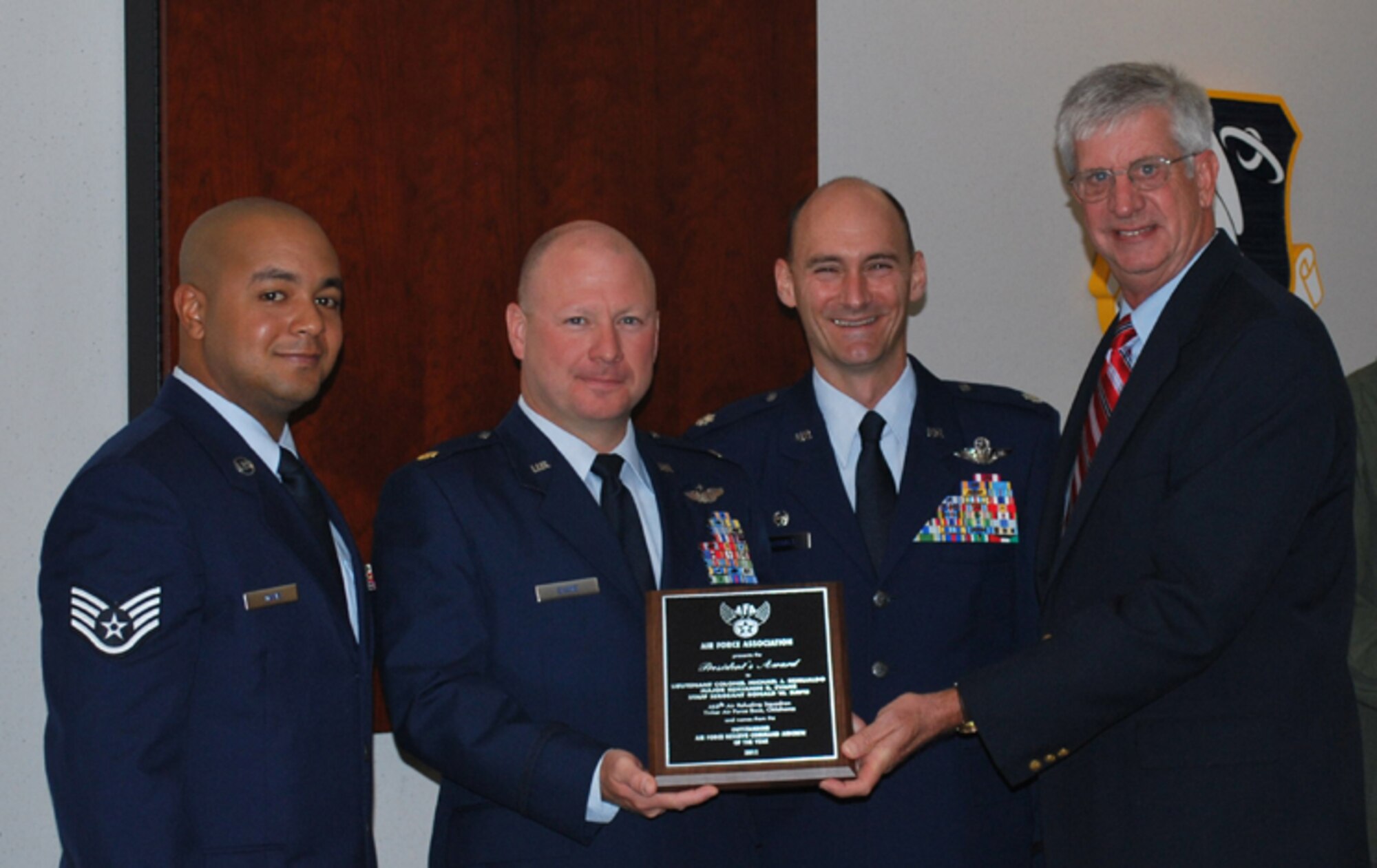 Colonel (USAF Ret) Mark Tarpley from the Air Force Association dropped by the 507th Air Refueling Wing's 465th Air Refueling Squadron August 7th to present the AFA's Outstanding Air Force Reserve Aircrew Award. Present to receive the award were (left to right) Staff Sgt. Ronald W. Davis and Maj. Benjamin R. Evans. Not pictured is the third award recipient Lt. Col. Michael J. Remualdo. Also shown are 465th ARS Commander Lt. Col. Thomas Hudnall and Col. Tarpley. The three aircrew members were chosen by the Air Force Association for their outstanding airmanship displayed during a Feb. 17, 2010 mission supporting combat operations in Operation IRAQI FREEDOM.