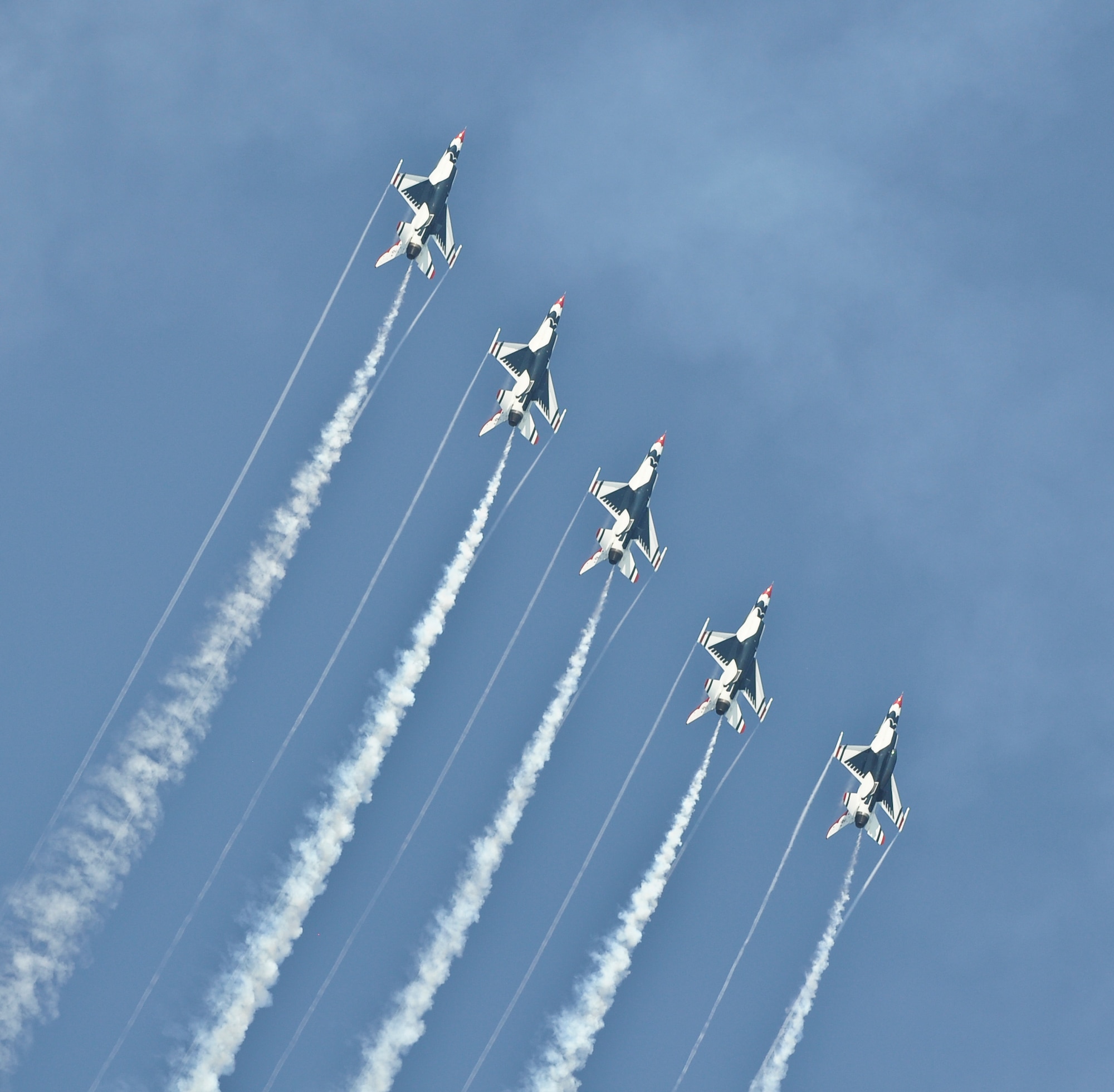 The Air Force Thunderbirds Air Demonstration Team performs a signature move during the 2011 Milwaukee Air and Water Show on Saturday, August 6.  The distinctively painted F-16C Falcons are assigned to Nellis Air Force Base, Las Vegas, Nevada, and they perform 70 shows per year in both the United States and abroad.  (U.S. Air Force photo by Staff Sgt. Jeremy Wilson / Released)