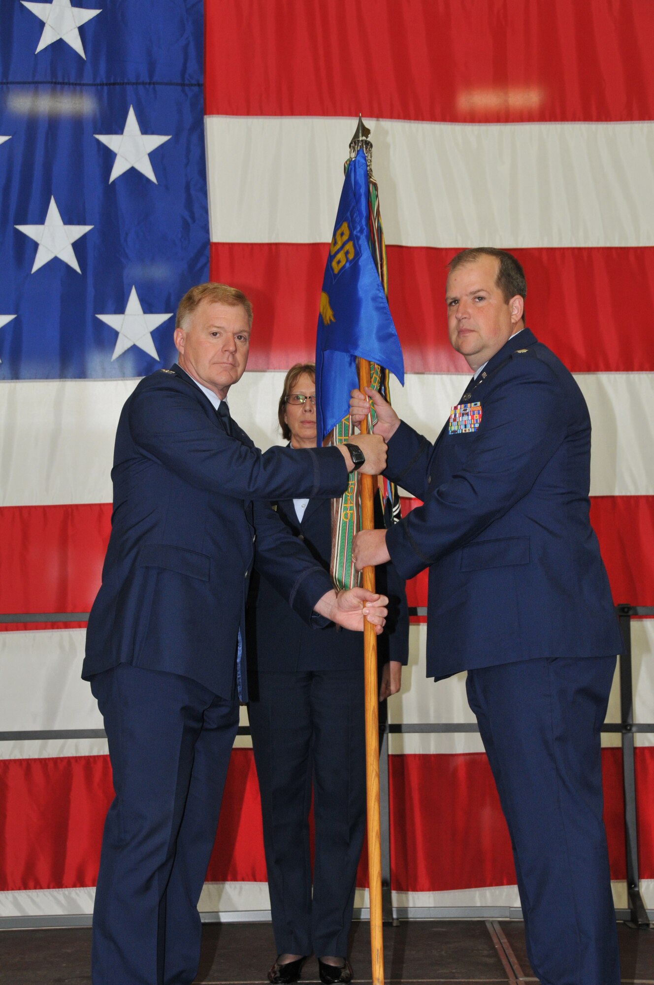 Lt. Col. Bruce D. Wiskus (right) recieves the guidon from Col. Ronald A. Wilt, commander 934 Operations  Group as he assumes command of the 96th Airlift Squadron during a change of command ceremony Aug 7.