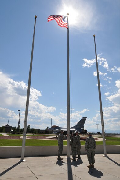 Members of the 140th Communications Flight wait for retreat to start on Buckley Air Force Base Colorado, August 6, 2011.  The flag will be presented to Chief David Allen, who is retiring after serving in the Colorado Air National Guard for more than 17 years, spanning five different decades.  (U.S. Air Force photo by: Tech. Sgt. Wolfram M. Stumpf)