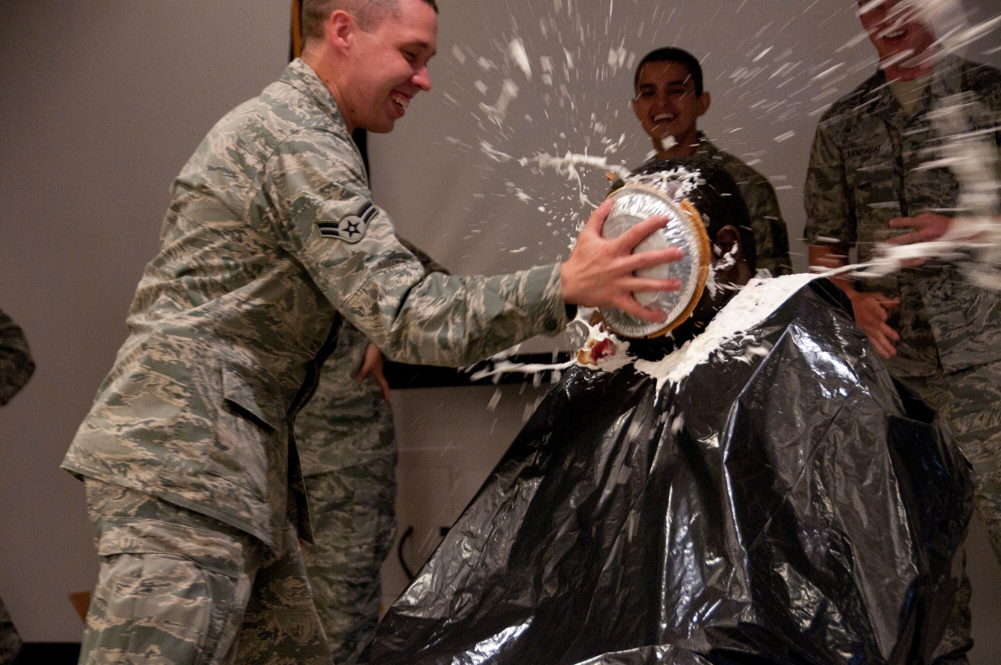 Chief Master Sgt. Bill Minter gets a pie in the face Aug. 6 from Airman 1st Class Michael Labreque. The 162nd Fighter Wing Junior Enlisted Council and wing senior leaders worked together on the “Pie in the Face” fund raising event to benefit several worthy JEC programs. (U.S. Air Force photo/Master Sgt. Dave Neve)