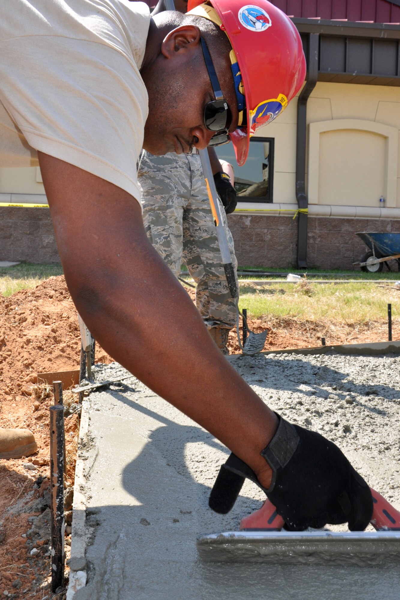 Tech. Sgt.  Jerry Gordon, a heavy equipment operator assigned to the 307th RED HORSE Squadron, uses a magnesium hand float to create a smooth surface on a construction project at Barksdale Air Force Base, La., Aug. 4, 2011. The Rapid Engineer Deployable Heavy Operations Repair Squadron Engineers (RED HORSE) Squadron was working on a construction project at the 93rd Bomb Squadron. (U.S. Air Force photo/Tech. Sgt. Jeff Walston) 

