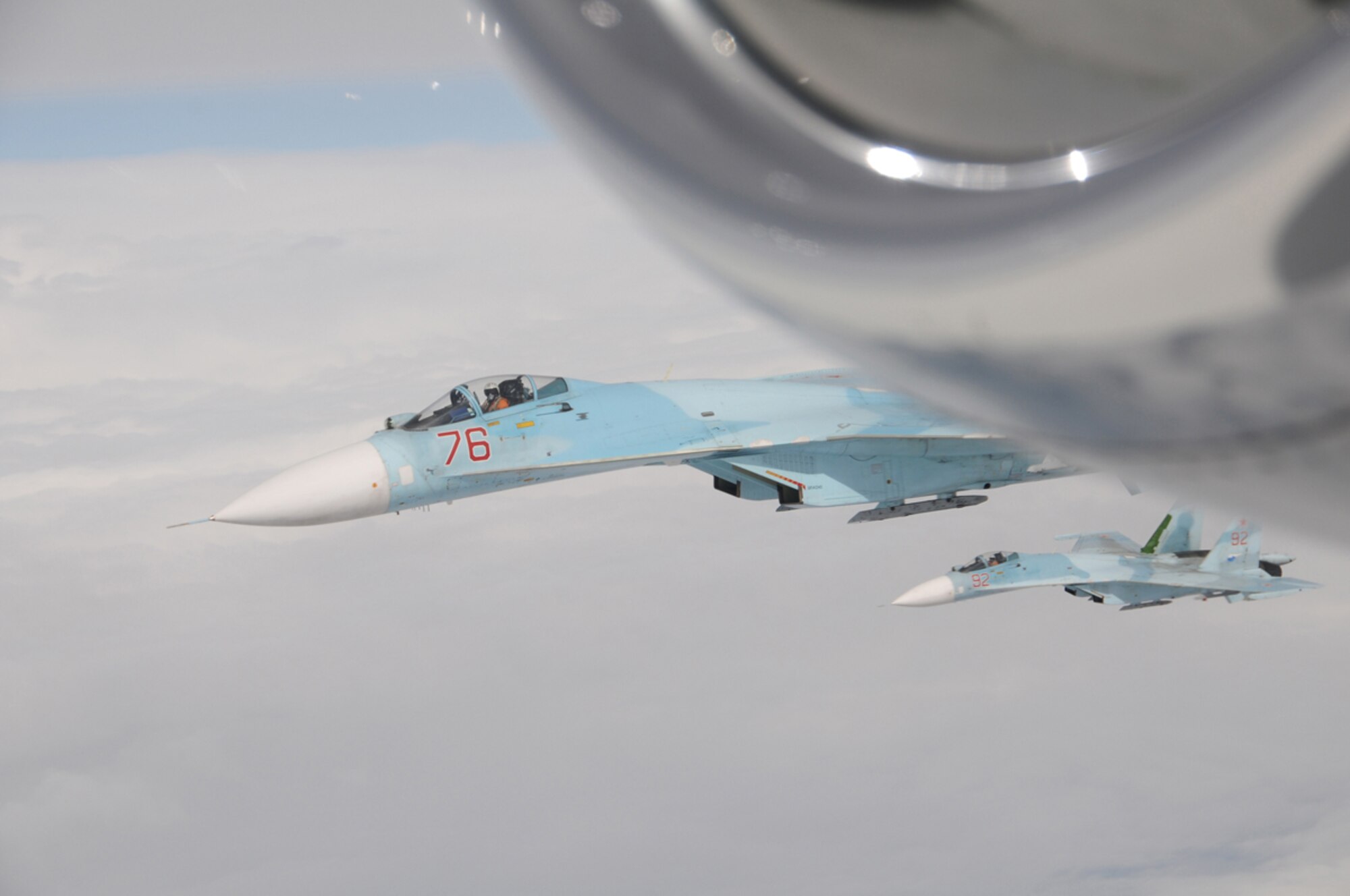 Two Russian SU-27 Flankers flying from Petropavlovsk-Kamchatski, intercepts Fencing 1220, a suspected hijacked aircraft during Exercise Vigilant Eagle Aug. 7.  Vigilant Eagle 2011 marks the second year of cooperation between the Russian Federation and NORAD to counter possible threats of air terrorism crossing international boundaries.  (U.S. Air Force photo by Capt. Uriah Orland)