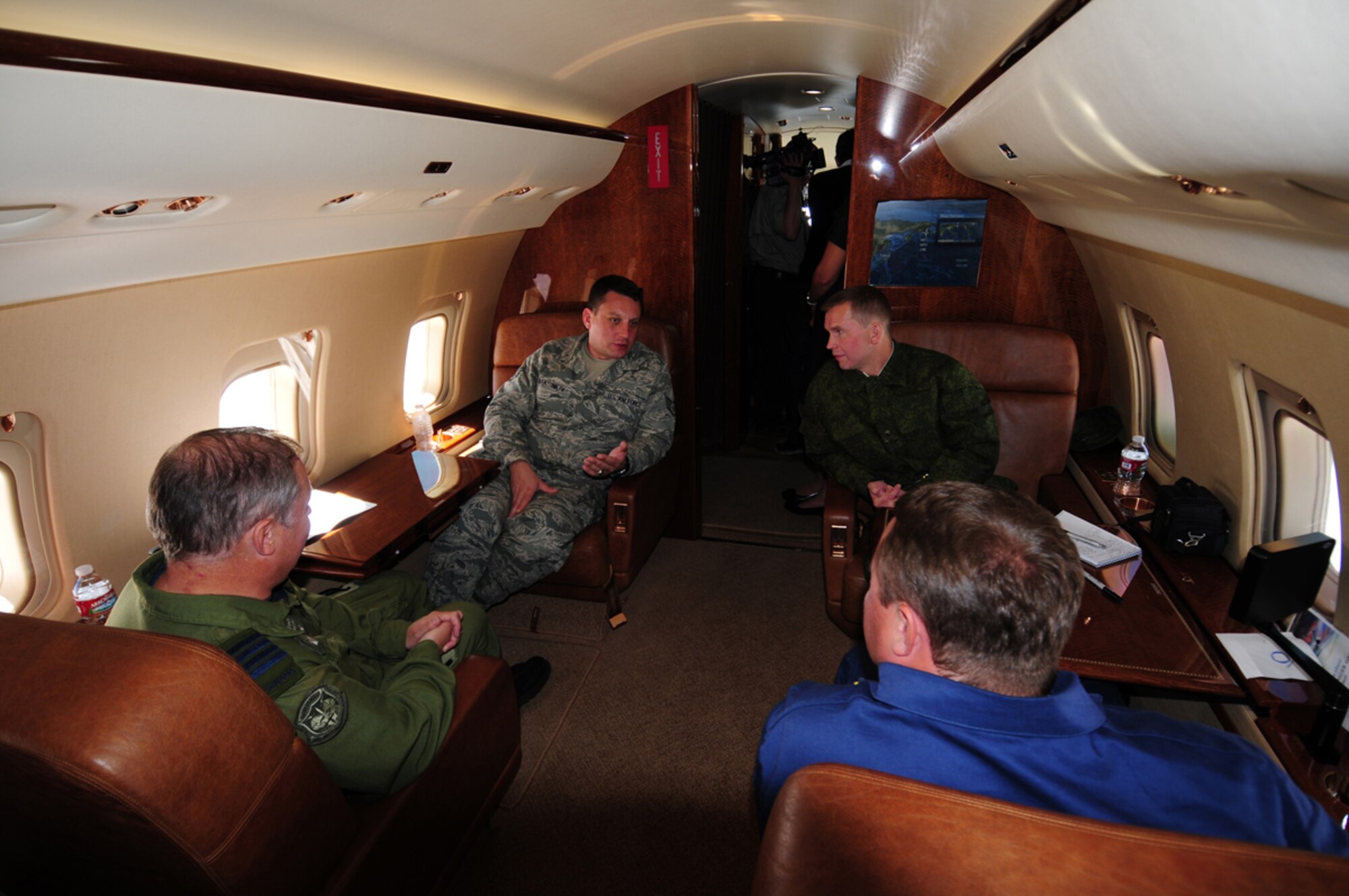 (Left to Right)  Canadian Col. Todd Balfe, Deputy Director, Alaskan NORAD Region; Staff Sgt. Yevgeniy Maksimov, Interpreter, Defense Threat Reduction Agency; Russian Col. Alexander Tikhonov, Editor Star; and Russian Col. Alexander Vasilyev, Russian Air Force Academy, discuss mission details on board the “Track of Interest” during Exercise Vigilant Eagle Aug. 7.  The exercise provided the opportunity for Russia, Canada and the United States to enhance their interagency partnership to cooperatively identify, intercept and follow a suspected hijacked aircraft as it proceeded across international boundaries. (U.S. Air Force photo by Capt. Uriah Orland)