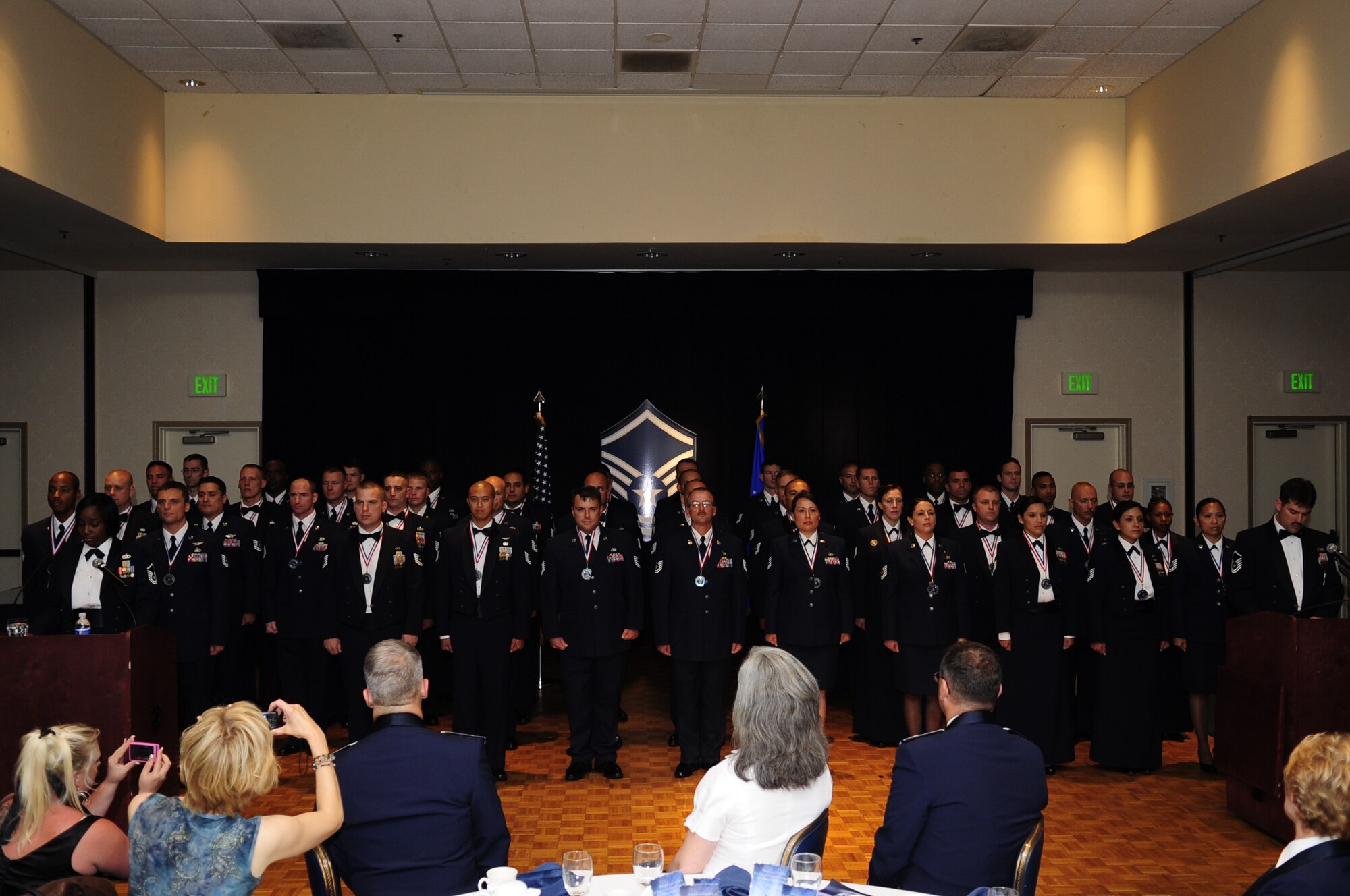 VANDENBERG AIR FORCE BASE, Calif. – Inductees stand at attention to formally be inducted as senior non-commissioned officers during the SNCO Induction Ceremony at the Pacific Coast Club here Friday, Aug. 5, 2011. The ceremony formally recognizes Airmen in the transition from the non commissioned officer to the senior NCO tier. (U.S. Air Force photo/Senior Airman Lael Huss)