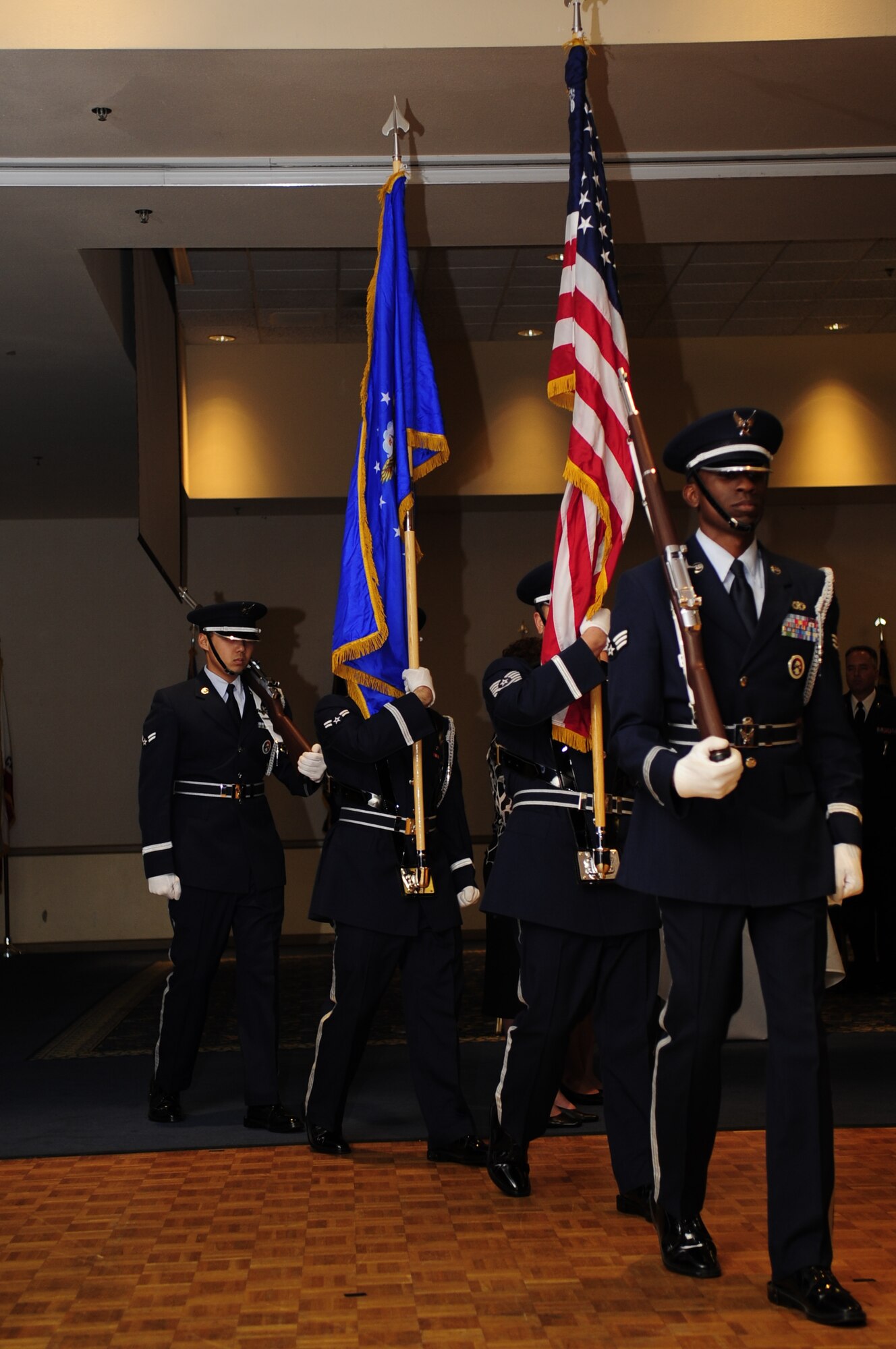 VANDENBERG AIR FORCE BASE, Calif. – Members of the Vandenberg Honor Guard present the colors during the Senior Non-commissioned Officer Induction Ceremony at the Pacific Coast Club here Friday, Aug. 5, 2011. The ceremony allows leadership, peers and family members to celebrate the inductees accomplishments. (U.S. Air Force photo/Senior Airman Lael Huss)