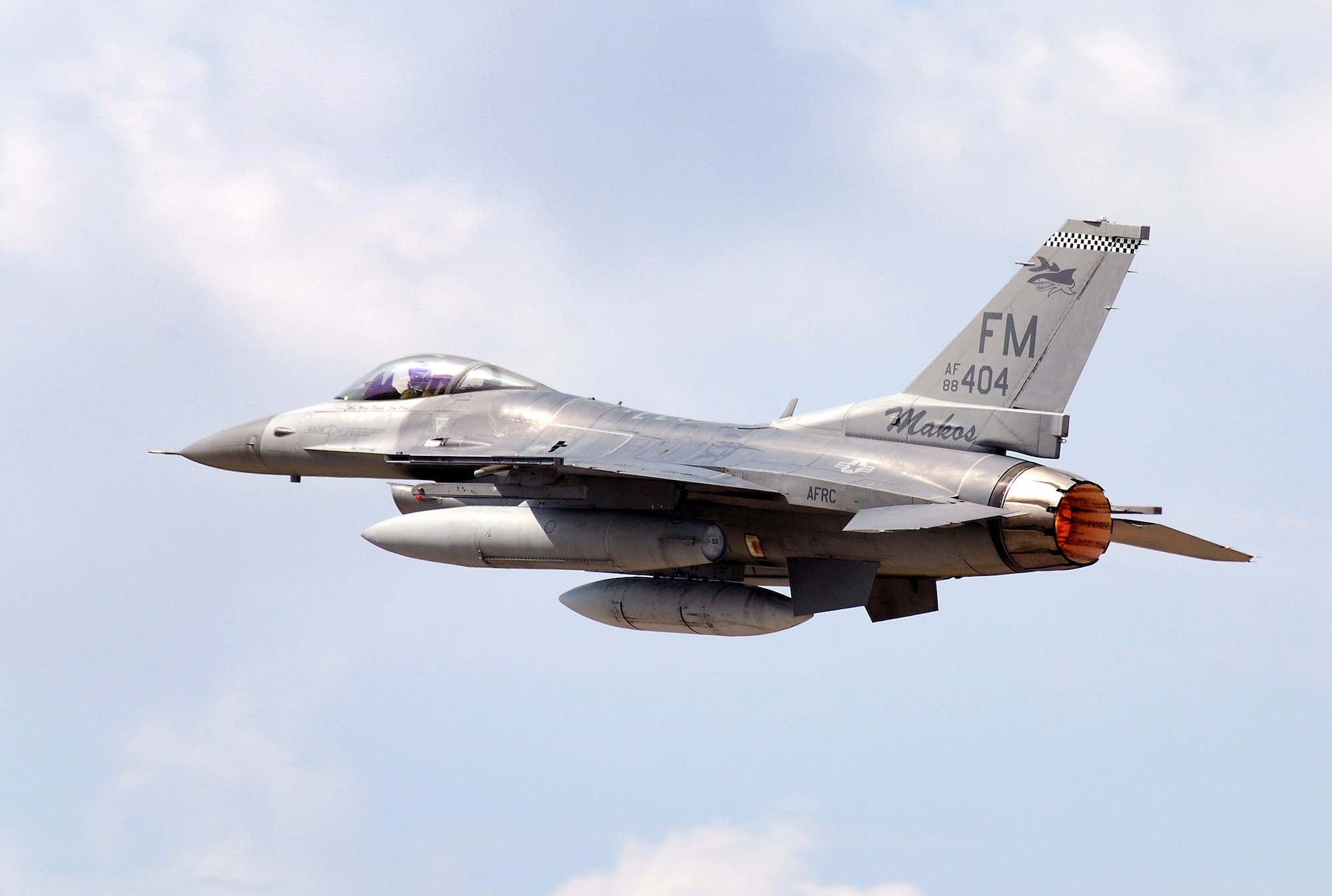 An F-16C block 30, General Electric powered fighter aircraft from the 482nd Fighter Wing at Homestead Air Reserve Base, Fla., thunders past with the maximum load of fuel and the afterburner lit at Dobbins Air Reserve Base, Ga., Aug 5. Pilots from the 93rd Fighter Squadron returned home to Florida after bringing their aircraft to Dobbins ARB as a precautionary measure to avoid possible damage from tropical storm Emily.  (U.S. Air Force photo/ Brad Fallin)