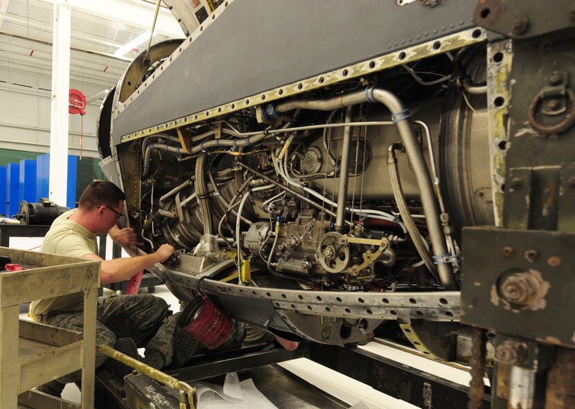 U.S. Air Force Airman 1st Class Gregory Thornton, 23rd Component Maintenance Squadron aerospace propulsion apprentice, uses a screwdriver to tighten bolts in the T-56 engine at Moody Air Force Base, Ga., Aug. 8, 2011. The T-56 engine is used in the HC-130 Combat King, an aircraft used for everything from combat delivery, humanitarian and disaster relief missions, air -to-air refueling and special operations. (U.S. Air Force photo by Senior Airman Stephanie Mancha/Released)

