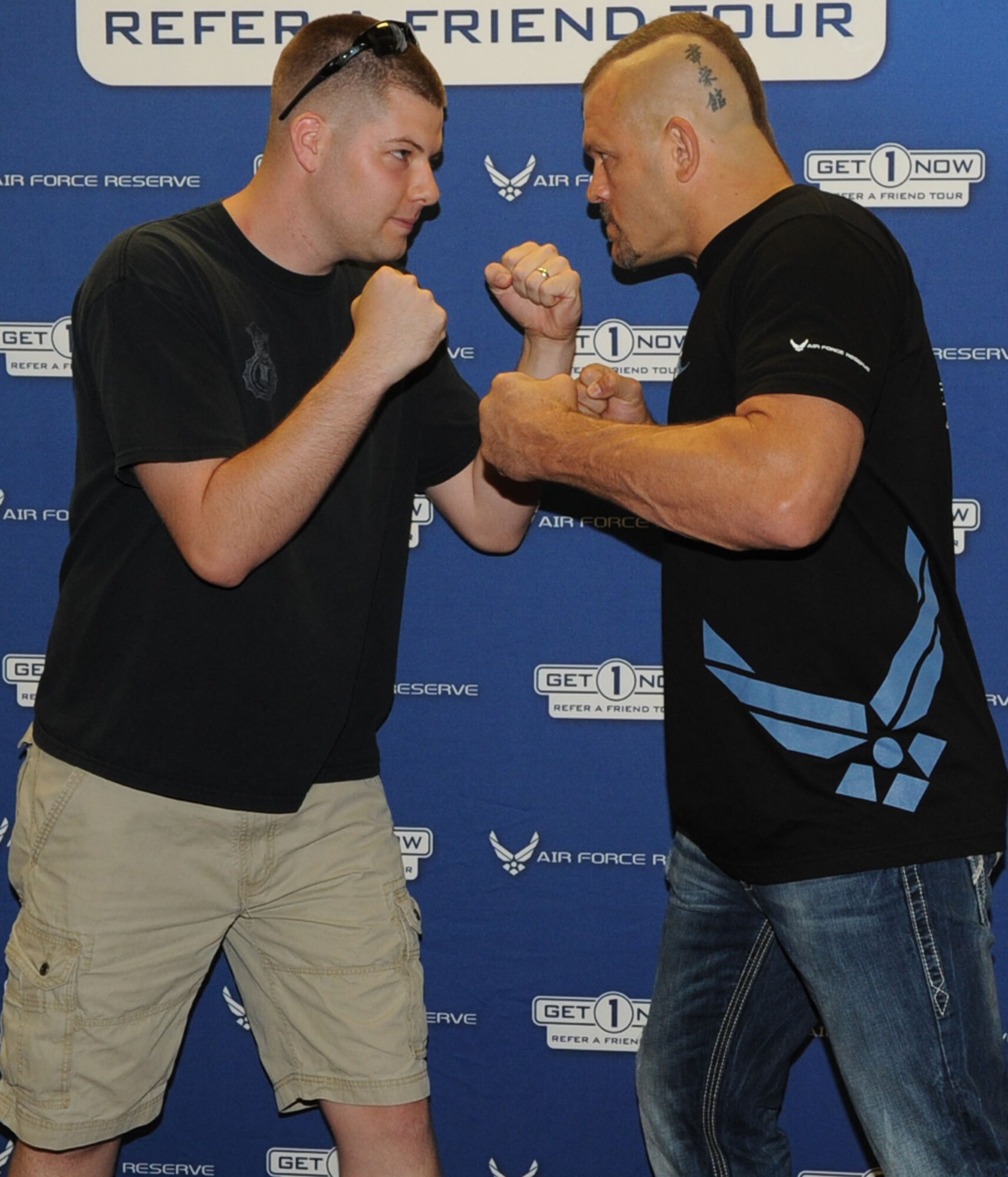 Staff Sgt. Bradley Enochs, 931st Security Forces Squadron, squares up against Chuck "The Iceman" Liddell, a retired mixed martial arts fighter and Ultimate Fighting Championship light heavyweight champion.  Liddell was visiting McConnell Air Force Base for the Get1Now program. Sergeant Enochs has consistently provided leads to recruiters resulting in accessions for the 931st Air Refueling Group. (Official Air Force photo by Staff Sgt. Carrie Peasinger)