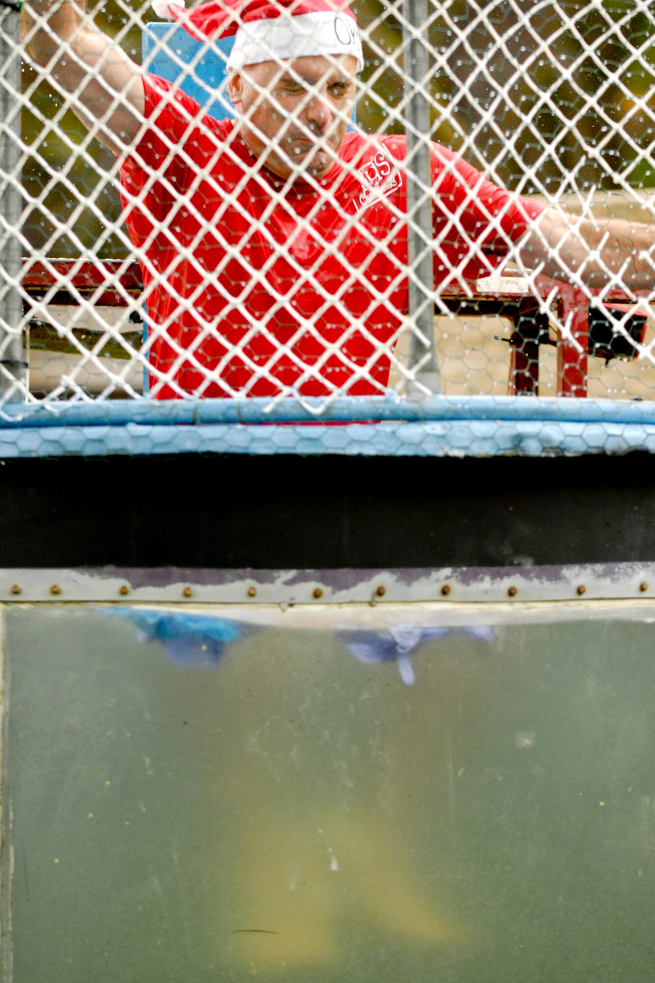 Vandenberg Air Force Base, Calif. -- Col. Richard Boltz, 30th Space Wing commander, gets dunked during the 23rd Annual Texas Blowout event at Cocheo Park here Friday, Aug. 5, 2011.  The Texas Blowout featured numerous activities to support Operations Kids Christmas.  (U.S. Air Force/Staff Sgt. Levi Riendeau)
