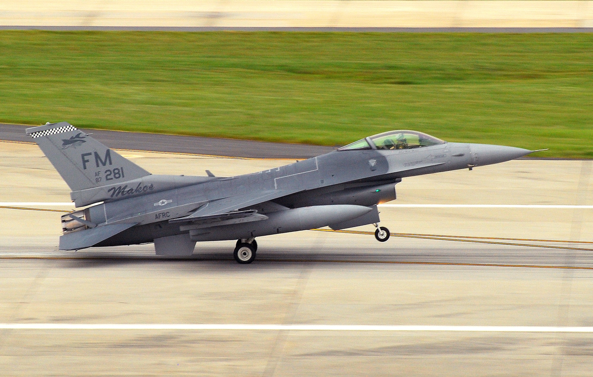 An F-16C block 30 General Electric powered fighter aircraft from the 482nd Fighter Wing at Homestead Air Reserve Base, Fla., rolls out after landing on the Dobbins Air Reserve Base runway, 4 Aug. Pilots from the 93rd Fighter Squadron flew the jets here as a precautionary measure to avoid possible damage from tropical storm Emily, currently brewing in the Atlantic Ocean.  (U.S. Air Force photo/ Shaun Shenk)