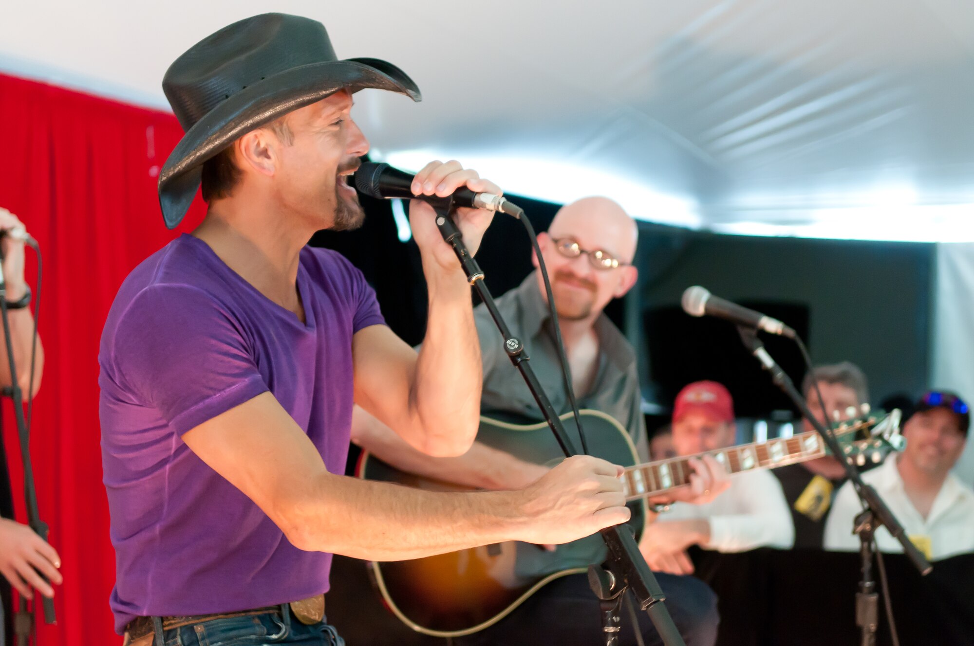 Tim McGraw and members of his tour band the Dancehall Doctors perform a private acoustic session for members of the Air Force Reserve and other VIPs prior to his concert Aug. 5 at the Comfort Dental Amphitheater in Denver. This was the second consecutive year McGraw has performed at a pre-show event for Reservists. (U.S. Air Force photo/Tech. Sgt. Nick Ontiveros)
