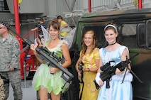 These princesses were packing some heat during the 916th Air Refueling Wing Family Day Picnic on Aug. 6, 2011. These young ladies volunteered their time to dress up for the children particpating in the annual wing celebration. (USAF photo by Tech. Sgt. Scotty Sweatt, 916ARW/PA)