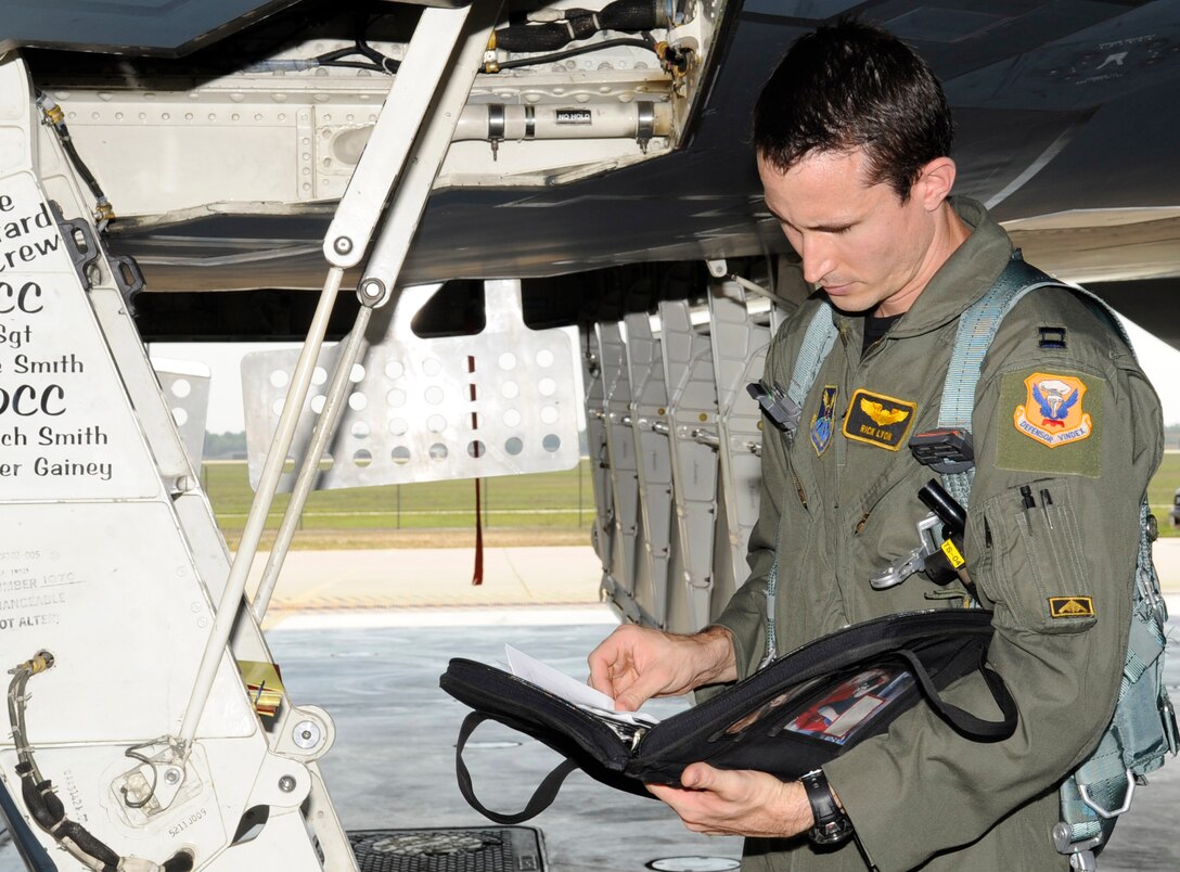 WHITEMAN AIR FORCE BASE, Mo. – Capt. Rick Lyon, 393rd Bomb Squadron pilot, reviews his checklist before departing Whiteman July 25 for the bomber operations portion of Air Force Global Strike Command's second annual Global Strike Challenge. (U.S. Air Force photo by Senior Airman Alexandra M. Boutte) (RELEASED)