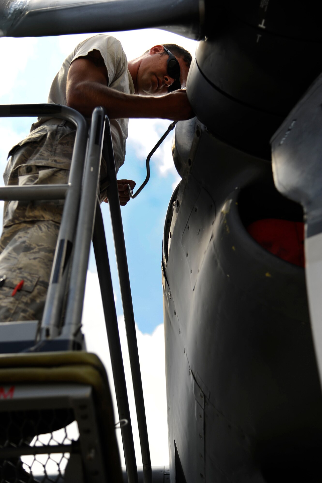 U.S. Air Force Staff Sgt. Keith Collins, 1st Special Operations Maintenance Squadron aerospace propulsion journeyman, works on an MC-130H Combat Talon II engine on the flightline at Eglin, Fla., July 25, 2011.  1st SOMXS maintainers spend countless hours before and after departure to ensure all aircraft can perform at an optimum level. (U.S. Air Force photo by Airman Gustavo Castillo)