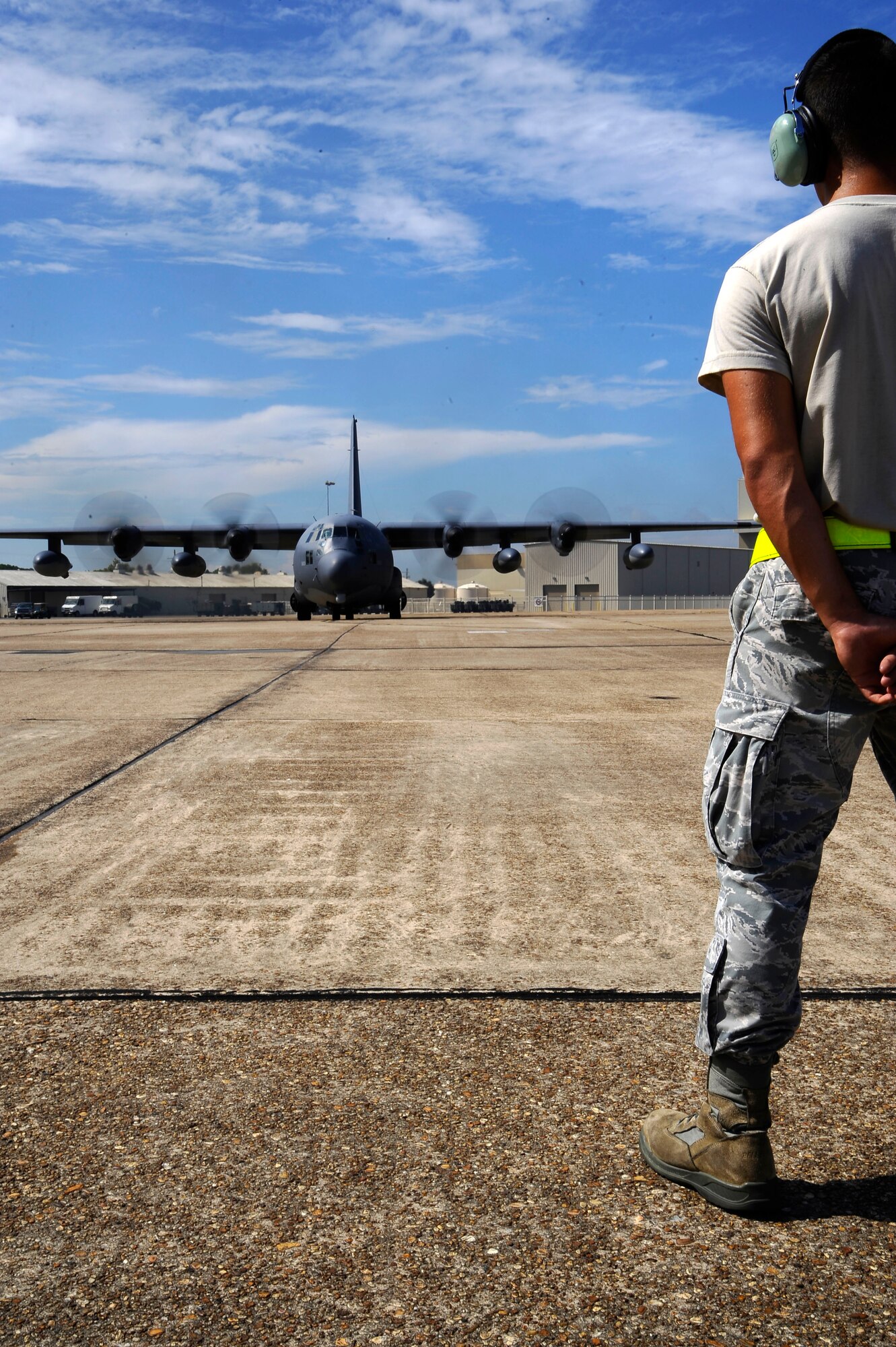 U.S. Air Force Senior Airman Jarred Shockey, 1st Special Operations Maintenance Squadron crew chief, observes an MC-130P Combat Shadow running pre-flight checks on the flightline at Eglin Air Force Base, Fla., July 25, 2011.  Part of a crew chief’s job is using technical data to diagnose maintenance problems on aircraft systems and interpreting and advising on maintenance procedures and policies to repair aircraft and related equipment. (U.S. Air Force photo by Airman Gustavo Castillo)