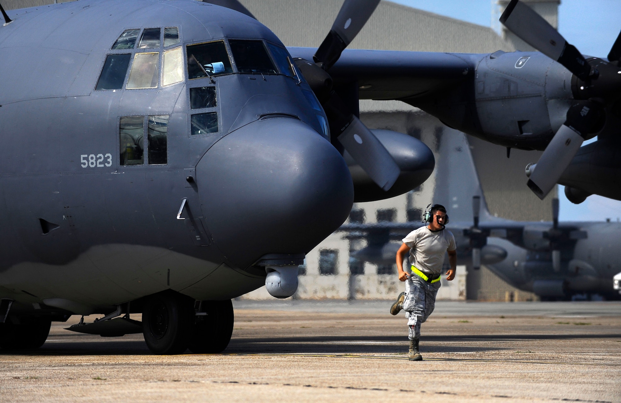 U.S. Air Force Senior Airman Jarred Shockey, 1st Special Operations Maintenance Squadron crew chief, runs to get in place as an MC-130P Combat Shadow finishes preflight checks during an exercise on the flightline at Eglin Air Force Base, Fla., July 25, 2011.  As a crew chief, Shockey has the responsibility to service the aircraft, perform inspections and advise on any problems with maintaining, servicing and inspecting aircraft. (U.S. Air Force photo by Airman Gustavo Castillo)
