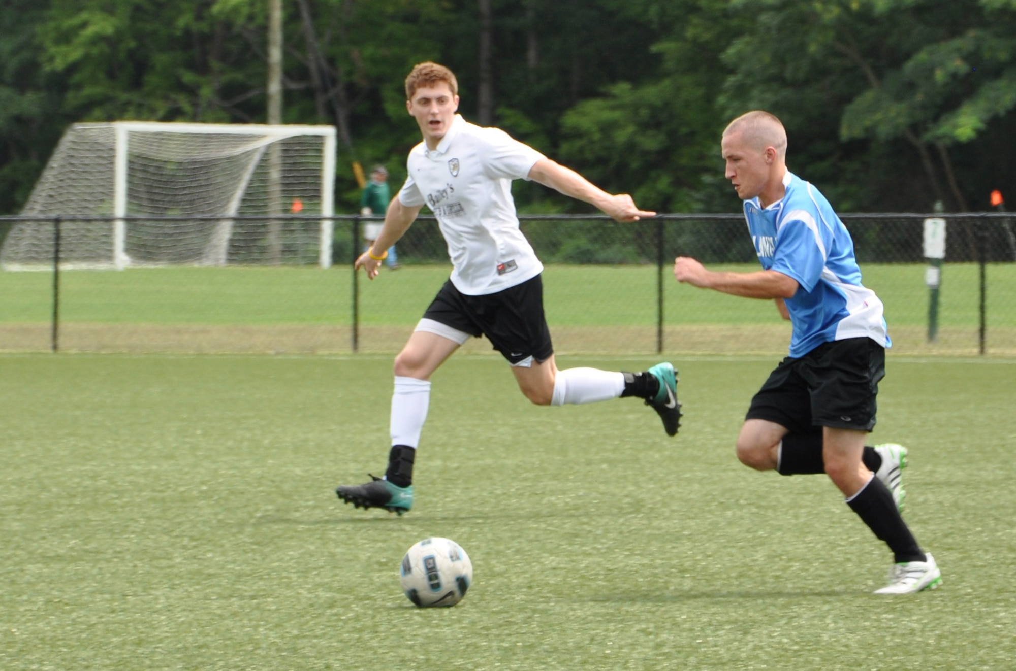 Travis Elswick, a Langley Raptors forward, dribbles the ball during a game at the Hampton Roads Soccer Complex in Virginia Beach, Va., Aug. 6, 2011. The Raptors will travel to Joint Base San Antonio, Texas, over the Labor Day weekend to participate in the annual Defender’s Cup, a national military invitational soccer tournament. Elswick is a staff sergeant assigned to the 1st Maintenance Squadron at Langley Air Force Base. (U.S. Air Force photo by Senior Airman Jason J. Brown/Released)