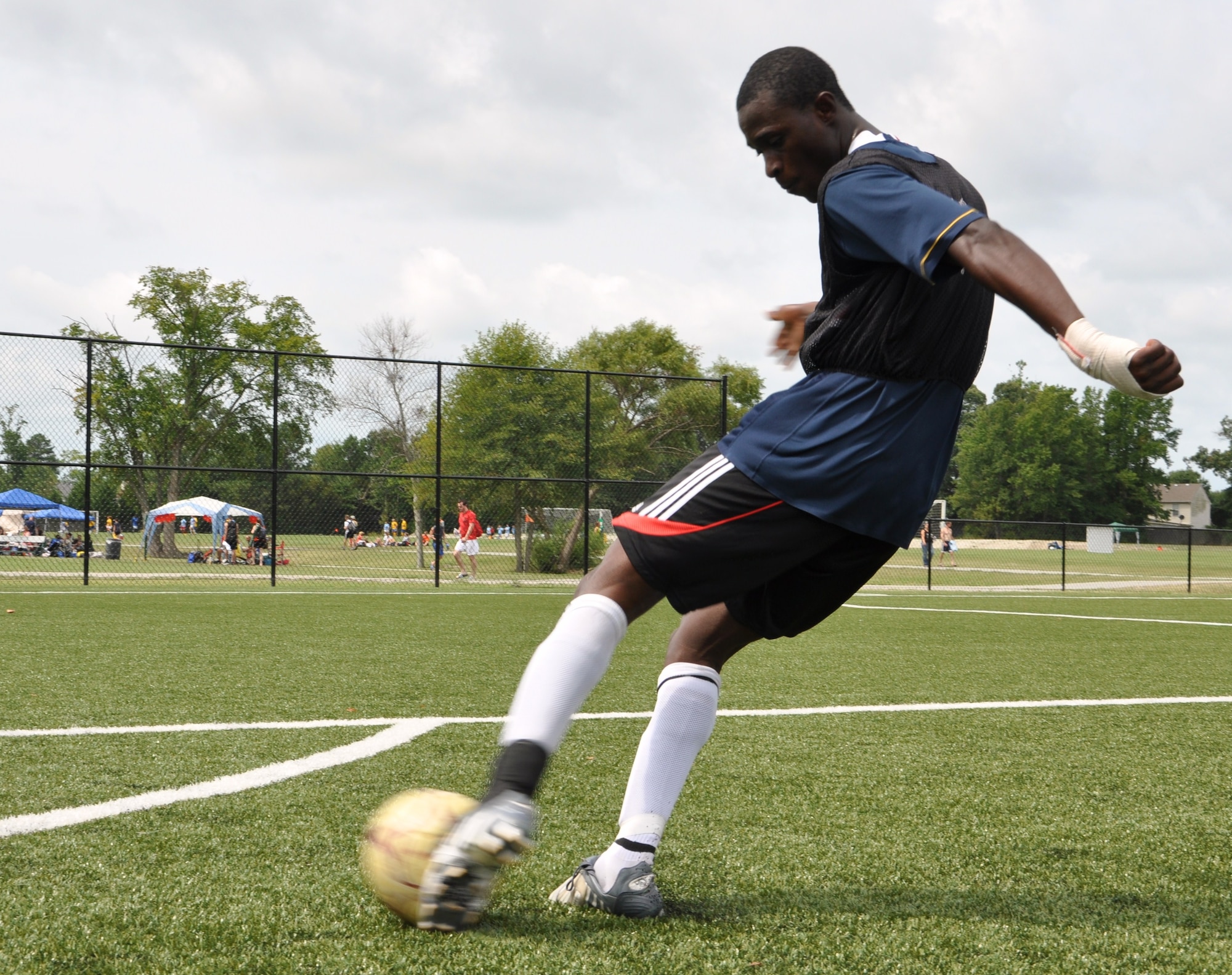 Albert Otoo-Annan, a Langley Raptors midfielder, shoots the ball during practice at the Hampton Roads Soccer Complex in Virginia Beach, Va., Aug. 6, 2011. The Raptors will travel to Joint Base San Antonio, Texas, over the Labor Day weekend to participate in the annual Defender’s Cup, a national military invitational soccer tournament. Otoo-Annan is an Airman 1st class assigned to the 633rd Inpatient Squadron at Langley Air Force Base. (U.S. Air Force photo by Senior Airman Jason J. Brown/Released)