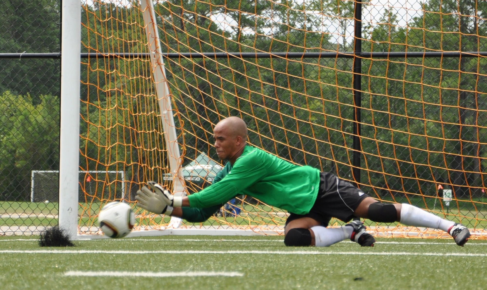 Jordan Kermoade, a Langley Raptors goalkeeper, dives to make a save during practice at the Hampton Roads Soccer Complex in Virginia Beach, Va., Aug. 6, 2011. The Raptors will travel to Joint Base San Antonio, Texas, over the Labor Day weekend to participate in the annual Defender’s Cup, a national military invitational soccer tournament. Kermoade is an Airman 1st class assigned to the 1st Aircraft Maintenance Squadron at Langley Air Force Base. (U.S. Air Force photo by Senior Airman Jason J. Brown/Released)