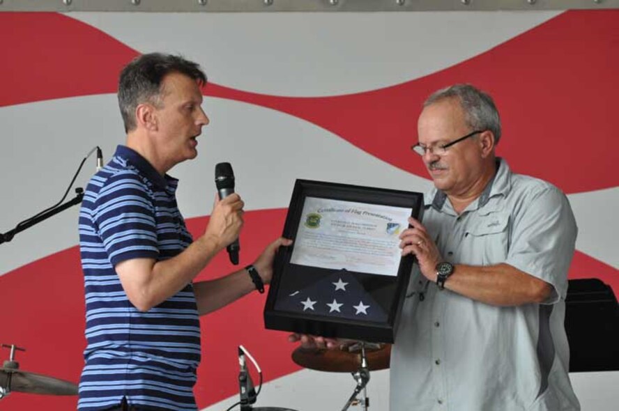 Col. Randy Ogden (right), 916th Air Refueling Wing commander, presents Whitley Church's Paster Jimmy with a plaque to show the wing's gratitude for all the volunteer efforts and donations he coordinated to make Family Day such a success. (USAF photo by 916ARW/PA)